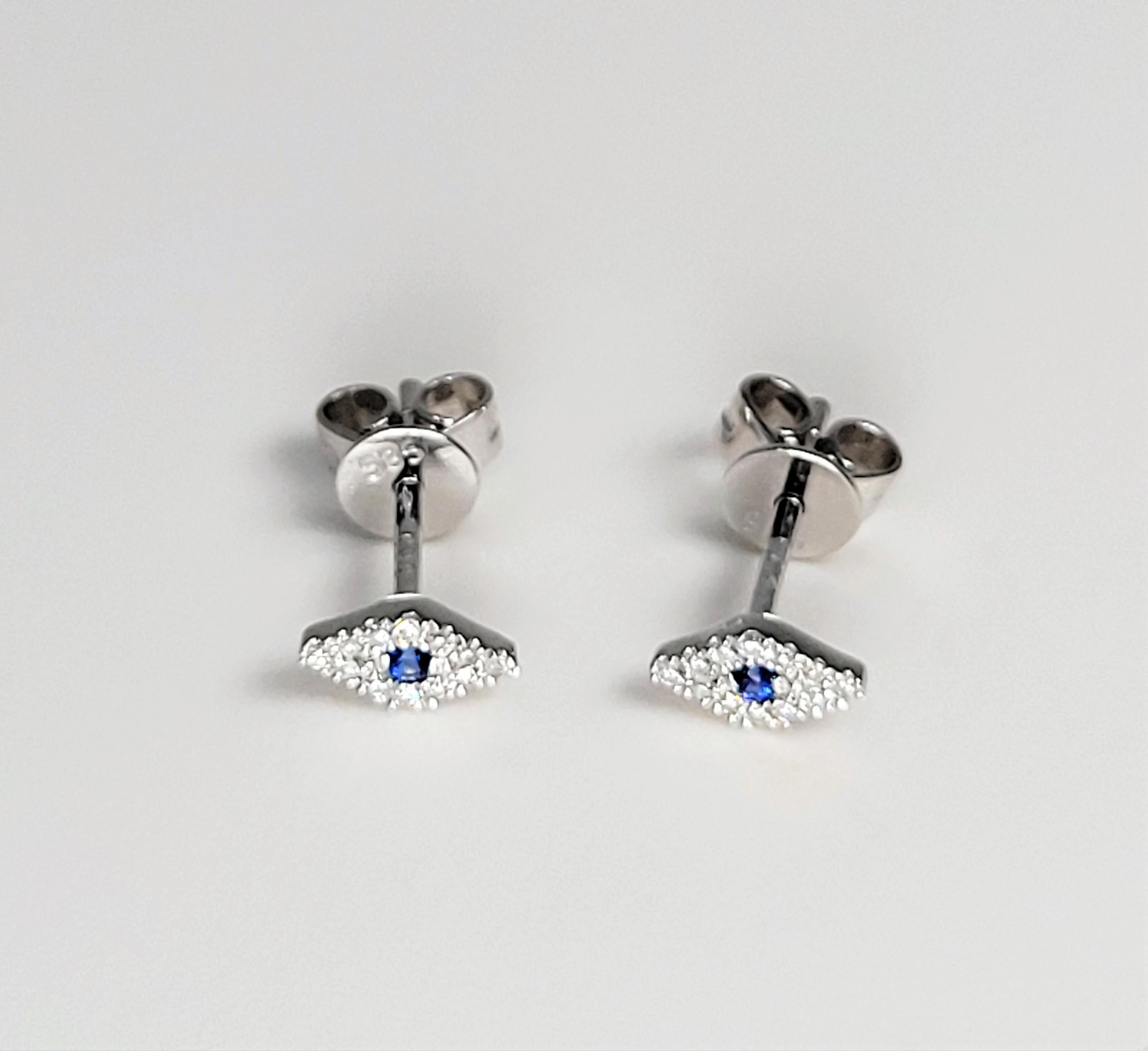 Fun and light!  These blue sapphire and diamond eye earrings are in 14 karat white gold. 