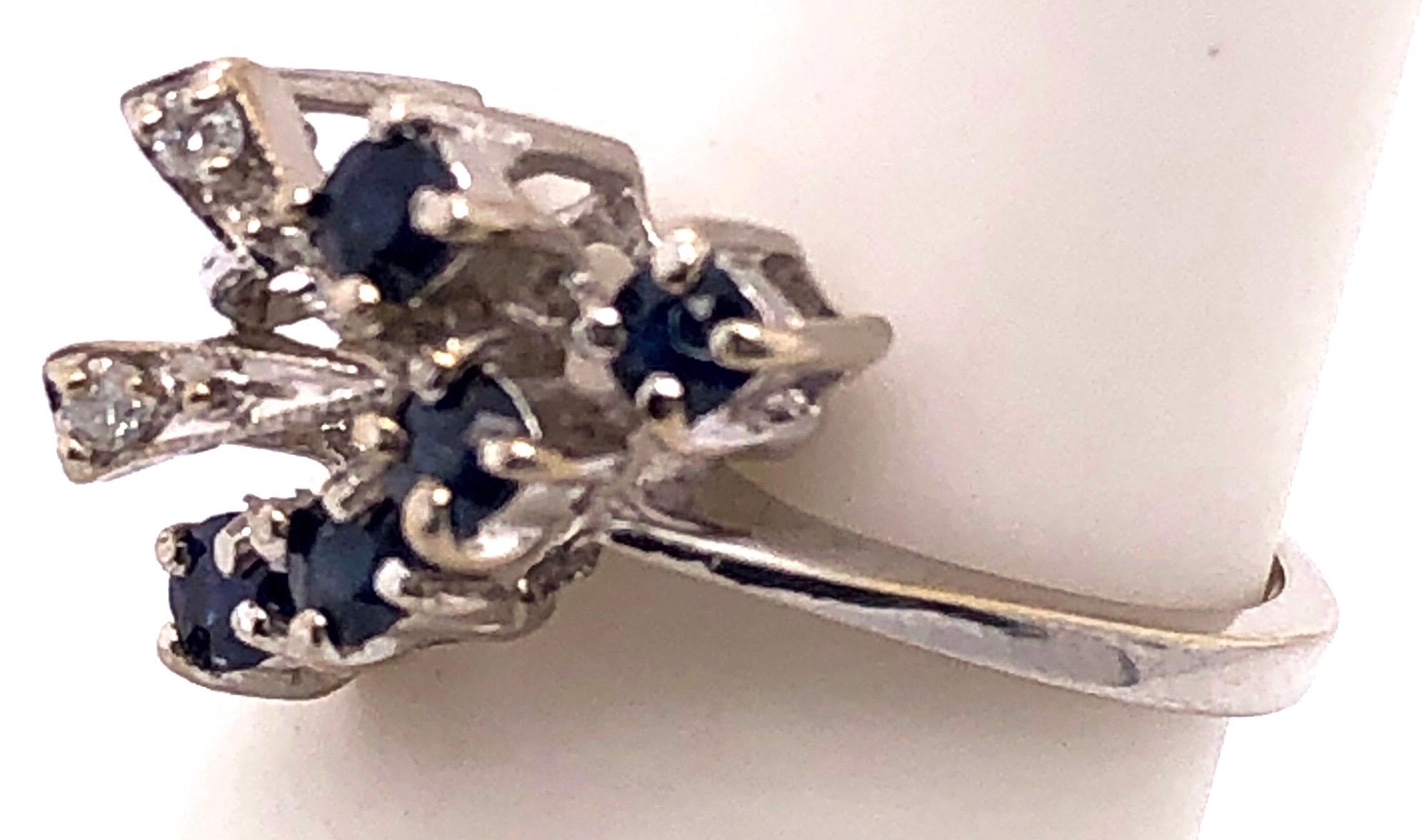 14 Karat White Gold Sapphire With Diamond Accents Free Form Ring
0.02 total diamond weight.
Size 6.5
3 grams total weight.