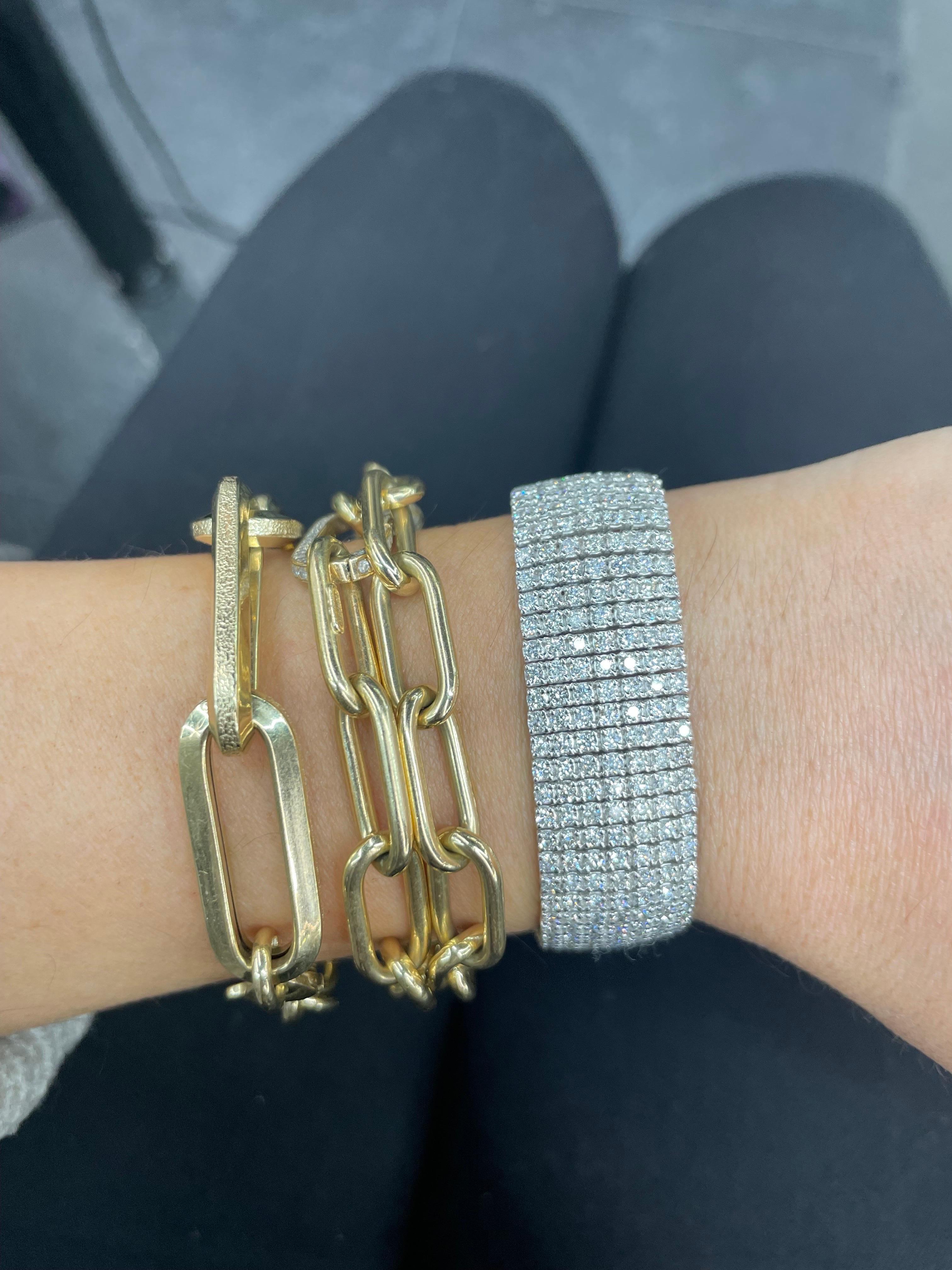 Seven row tennis bracelet featuring 511 round brilliants weighing approximately 10.22 carats, in 14 karat white gold. 