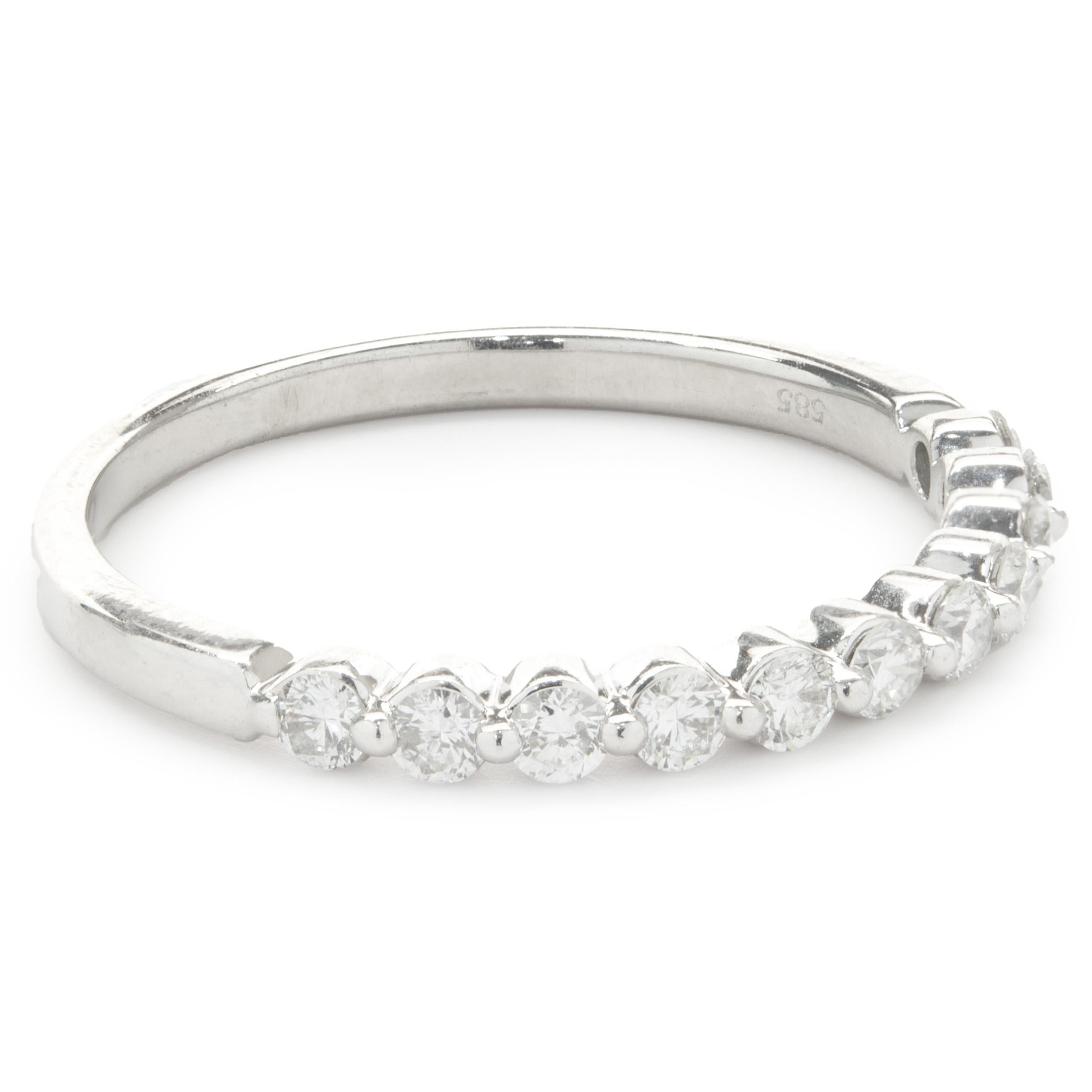Designer: custom
Material: 14K white gold
Diamond: 11 round brilliant cut = 0.44cttw
Color: G
Clarity: SI1
Size: 6.75 complimentary sizing available 
Weight: 1.57 grams