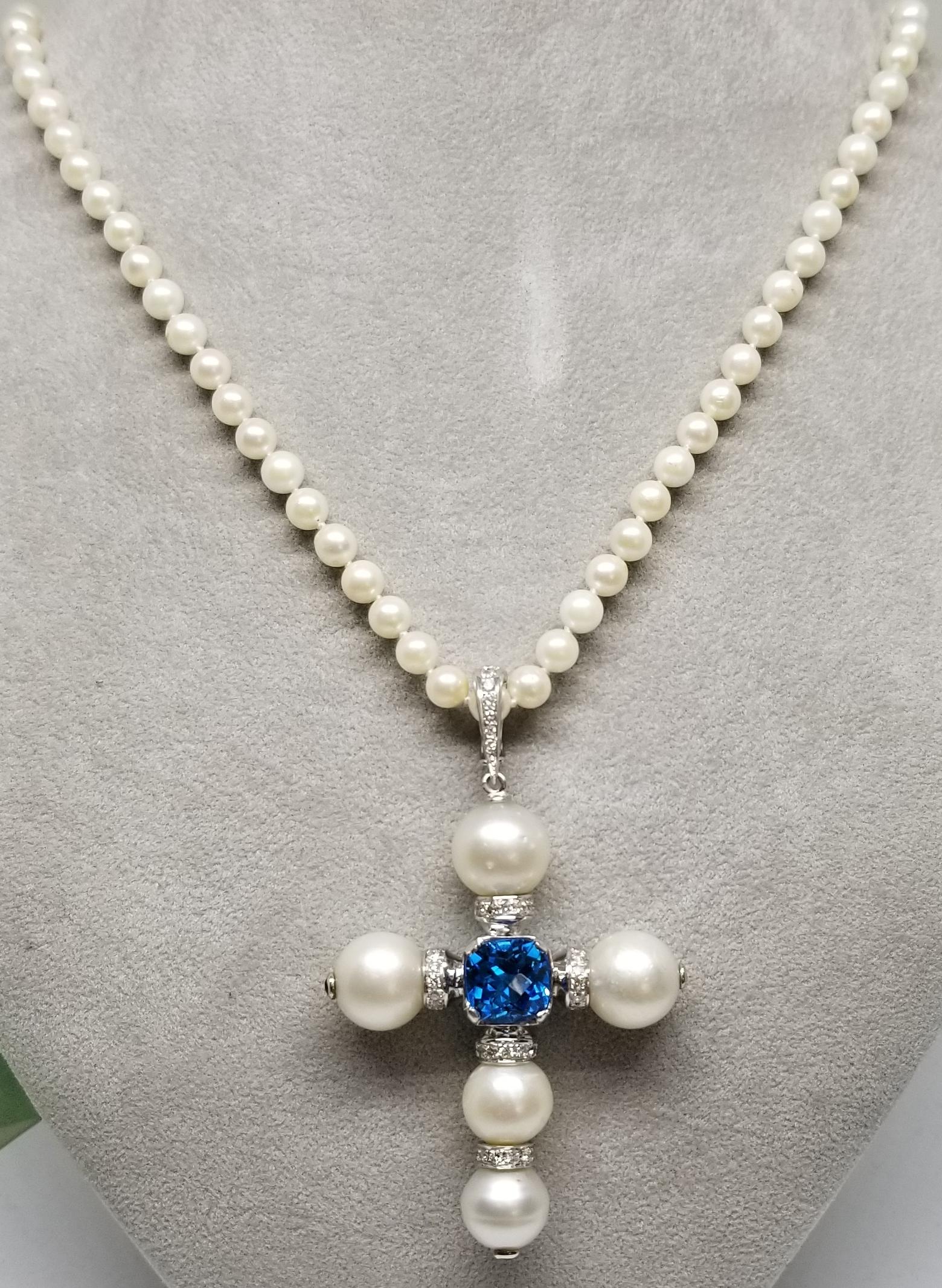 Contemporary 14 Karat White Gold South Sea Pearl Cross with a Swiss Blue Topaz and Diamonds For Sale