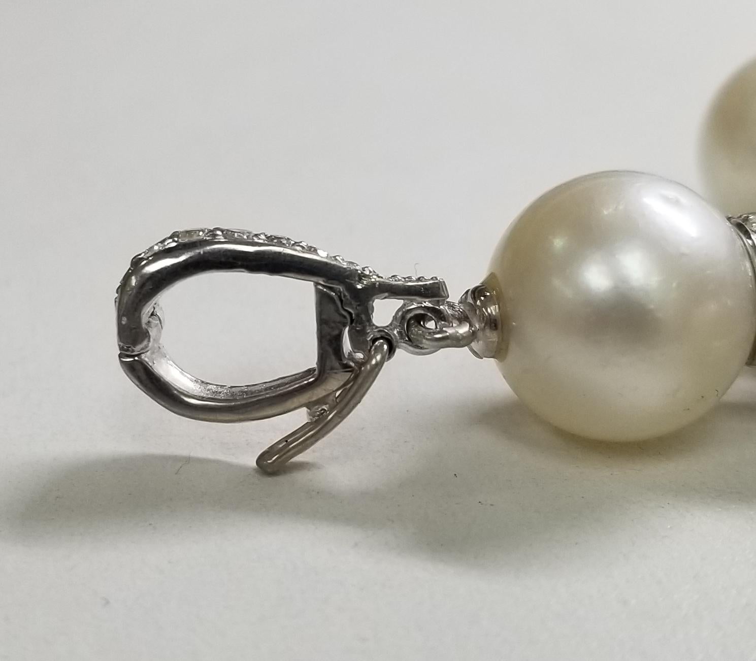 14 Karat White Gold South Sea Pearl Cross with a Swiss Blue Topaz and Diamonds In New Condition For Sale In Los Angeles, CA