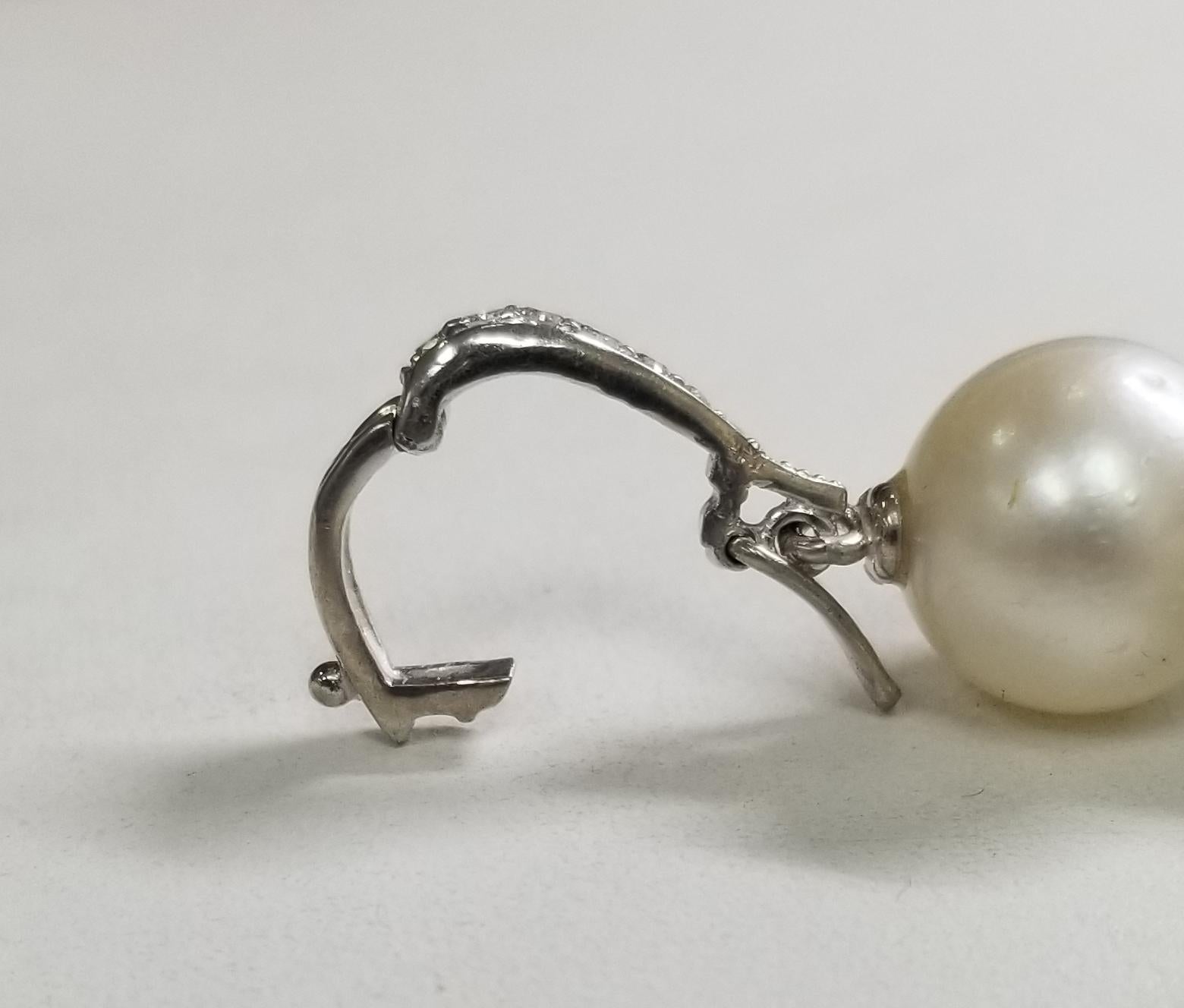 14 Karat White Gold South Sea Pearl Cross with a Swiss Blue Topaz and Diamonds For Sale 1