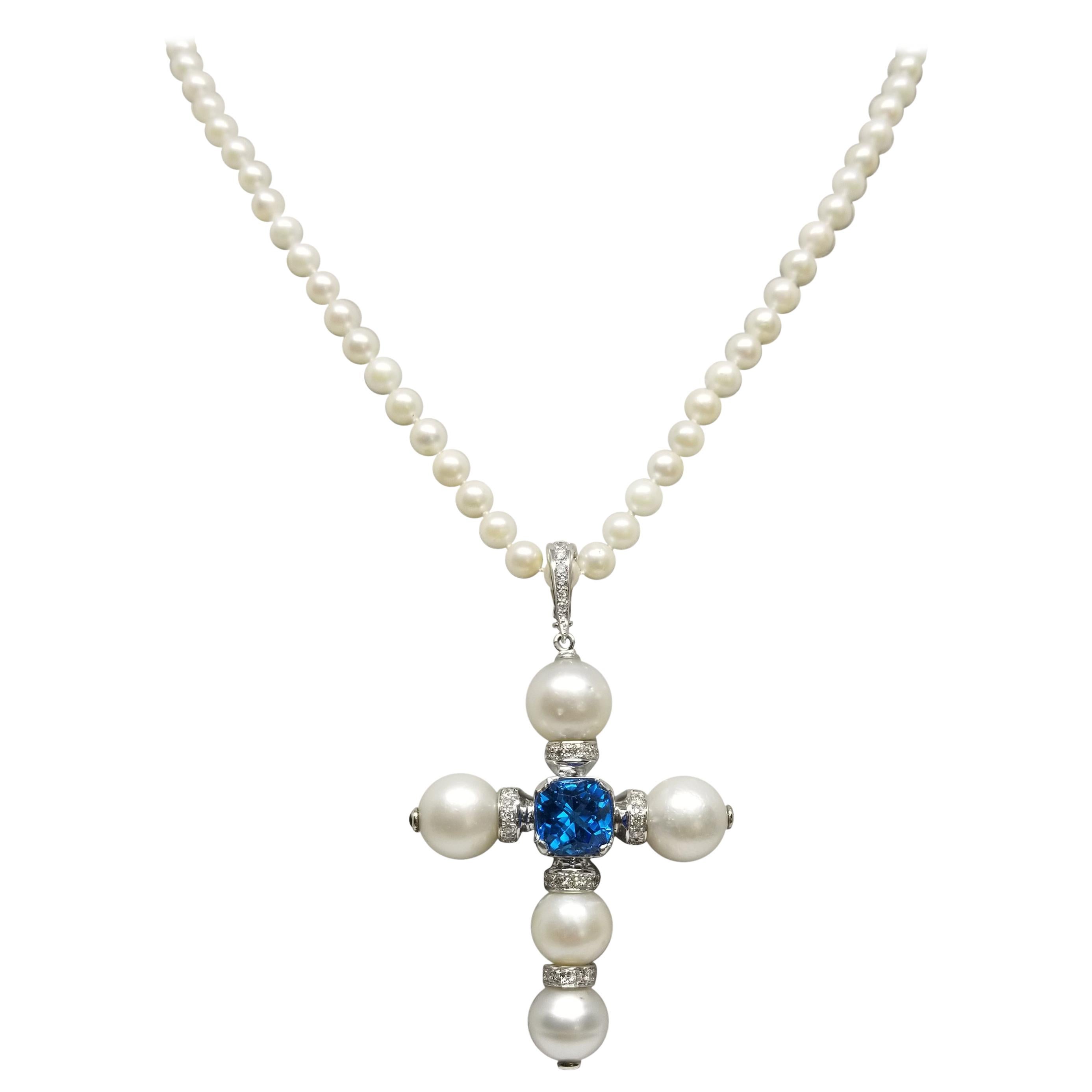 14 Karat White Gold South Sea Pearl Cross with a Swiss Blue Topaz and Diamonds For Sale
