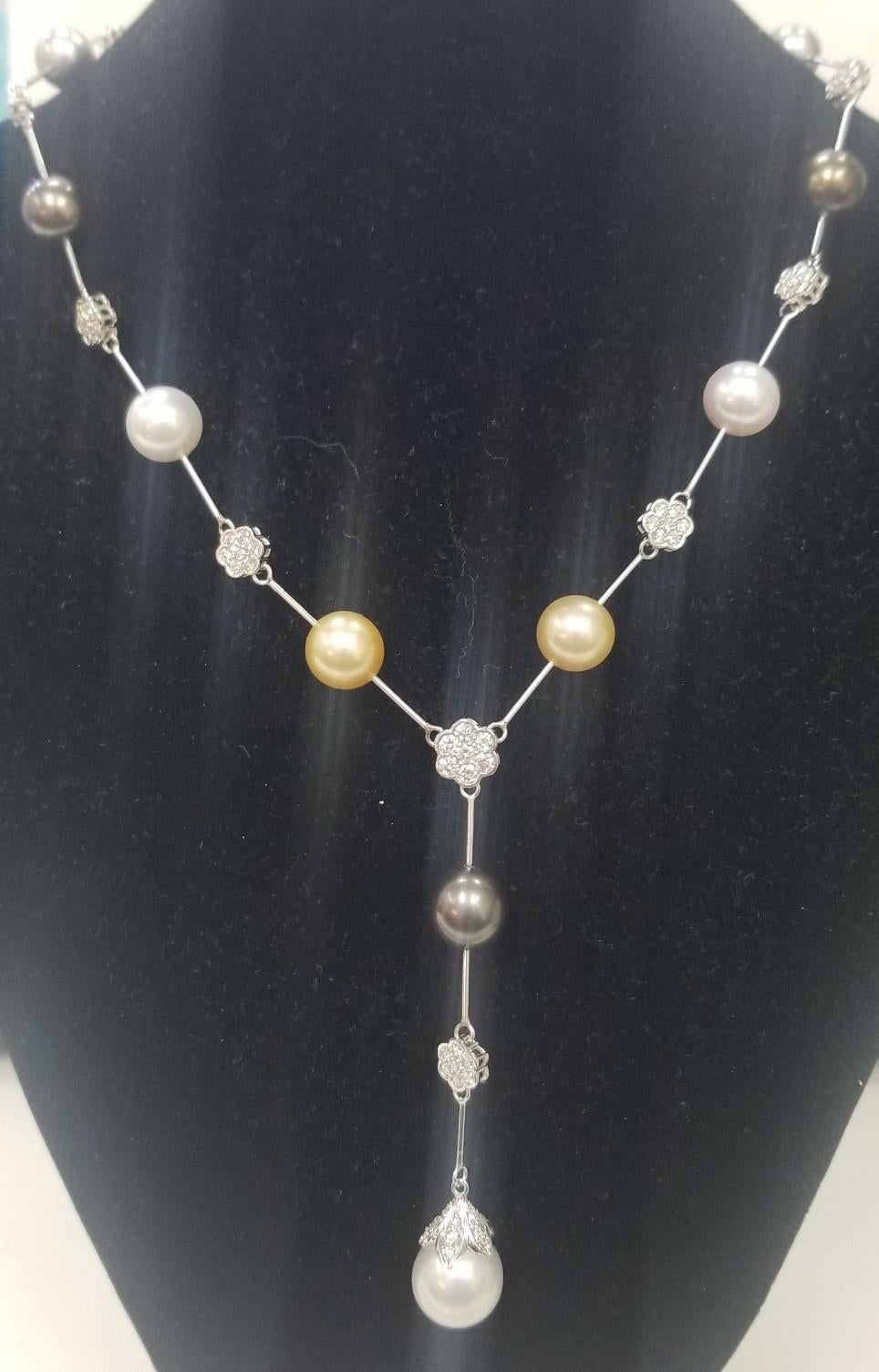 14k WG South Sea Pearl multi colored and diamond necklace, containing 10 multi natural colored south sea pearls measuring 9.5mm-12mm.  Also 108 round full cut diamonds; color 