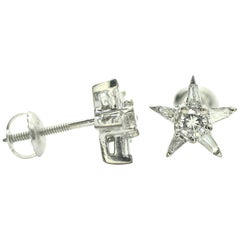 Orecchini con diamanti a forma di stella in oro bianco 14 carati