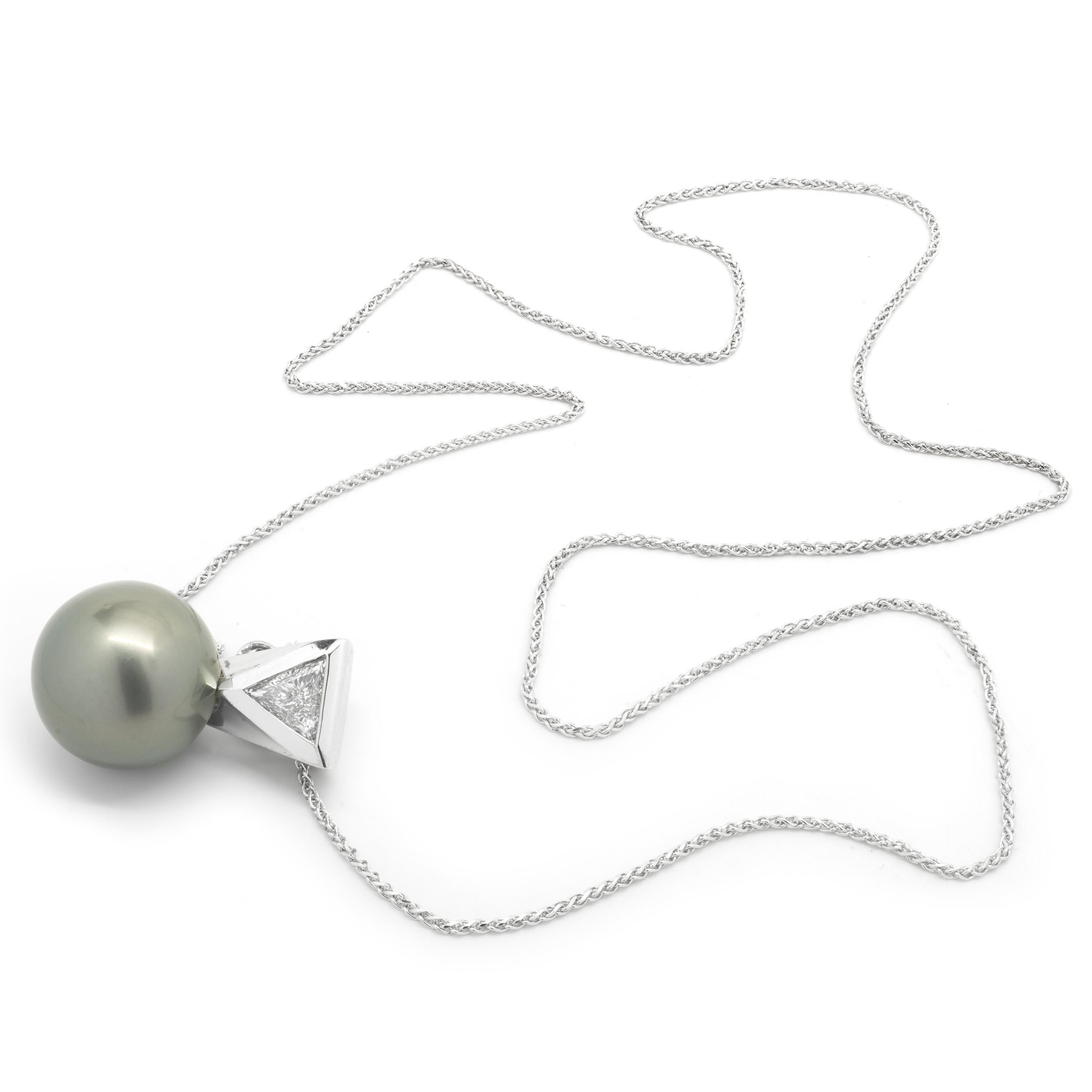 Designer: Custom
Material: 14K white gold
Pearl: Tahitian pearl = 13.4mm
Diamond: 1 trillion cut = .45ct
Color: I
Clarity: SI2
Dimensions: necklace measures 18-inches in length
Weight: 8.75 grams
