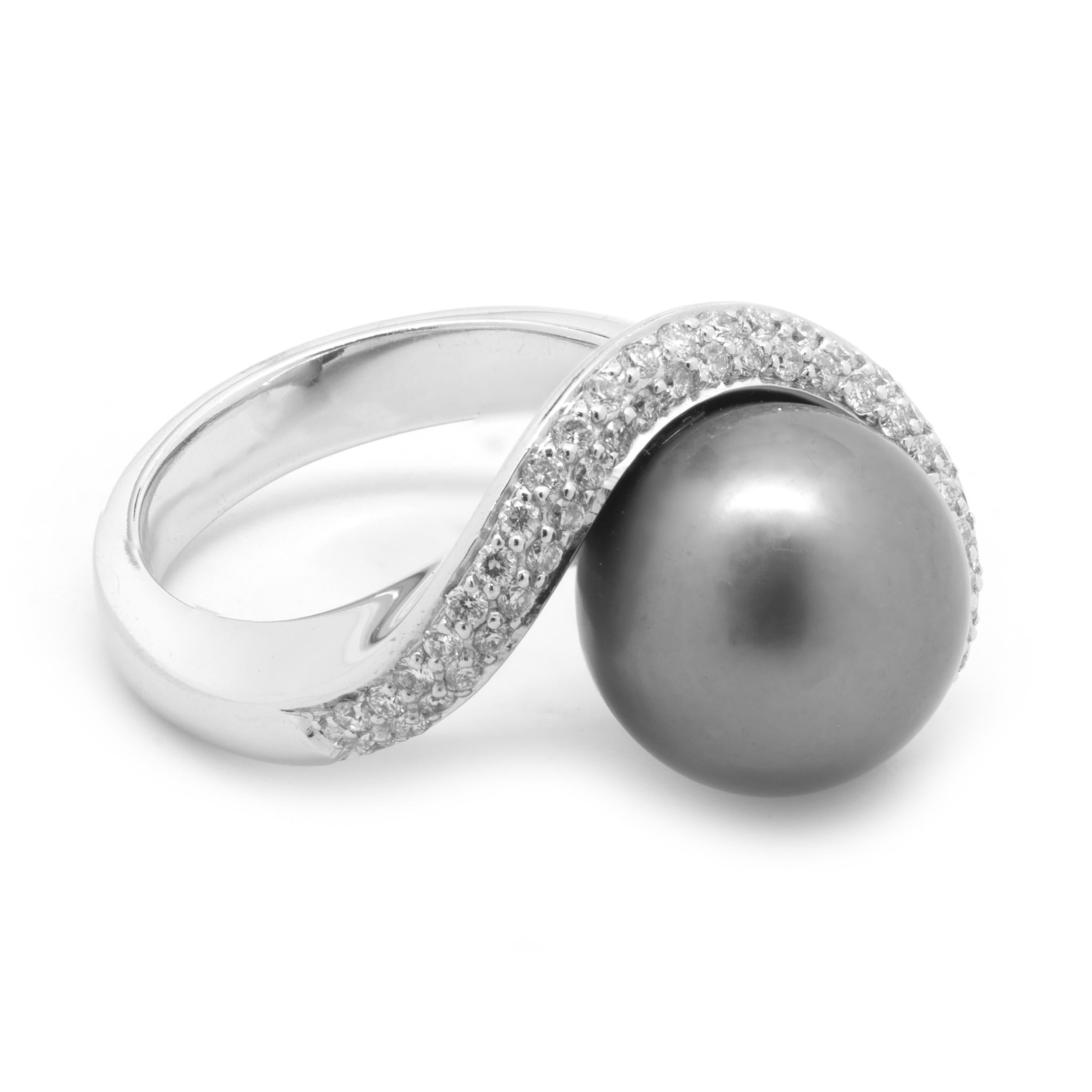 Material: 14K white gold
Pearl: 1 11.25MM Tahitian pearl
Diamonds: 53 round cut = .53cttw
Color: H
Clarity: SI1
Ring Size: 7 (please allow two additional shipping days for sizing requests)
Dimensions: ring measures 15.5mm wide
Weight:  12.03 grams
