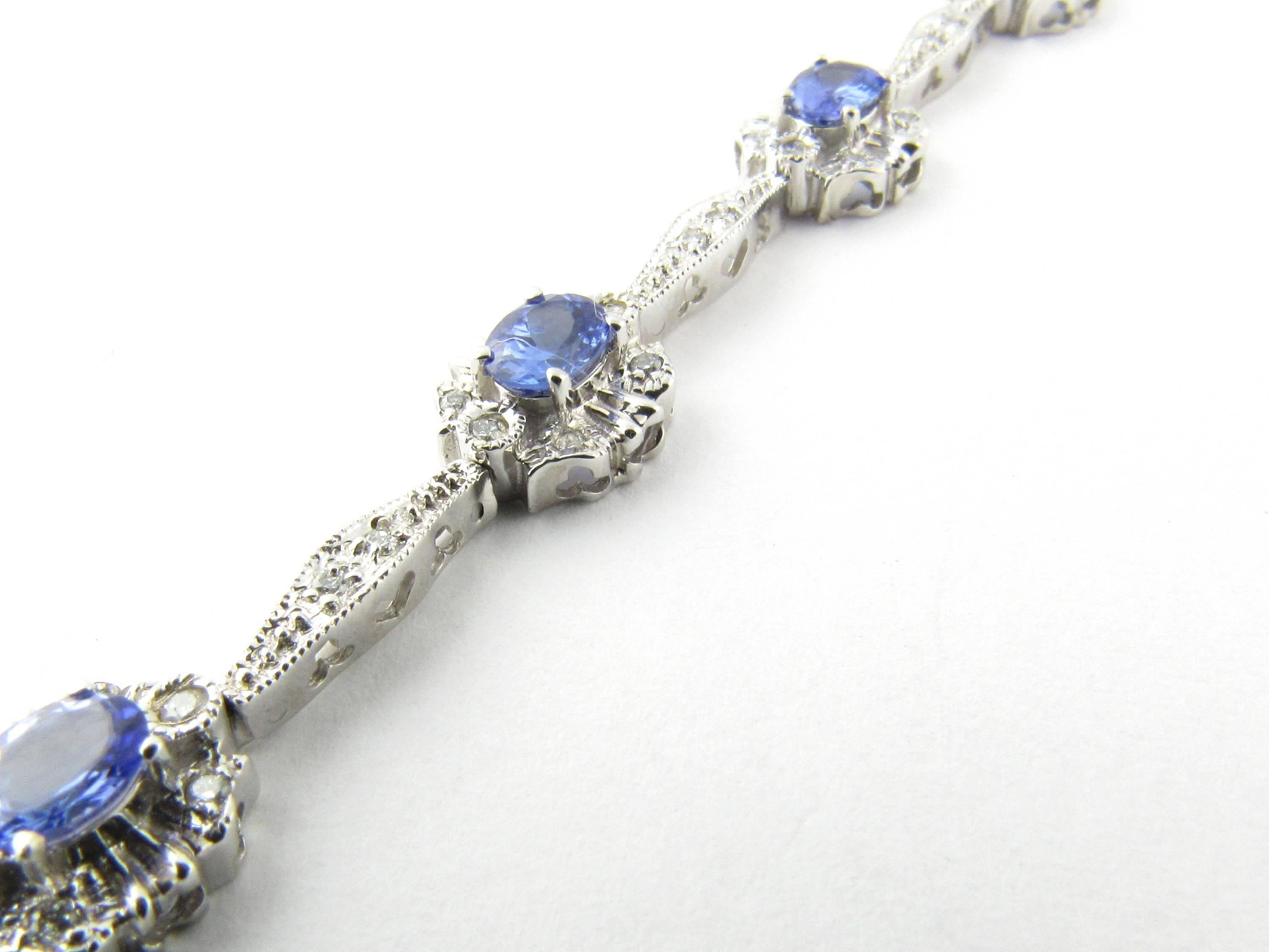 Vintage 14 Karat White Gold Tanzanite and Diamond Bracelet- 
This exquisite bracelet features eight oval tanzanite stones (5 mm x 4 mm each) surrounded by 64 sparkling round brilliant cut diamonds and set in classic 14K white gold. 
Approximate