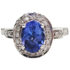 14 Karat White Gold Tanzanite and Diamond Filigree Engagement Ring