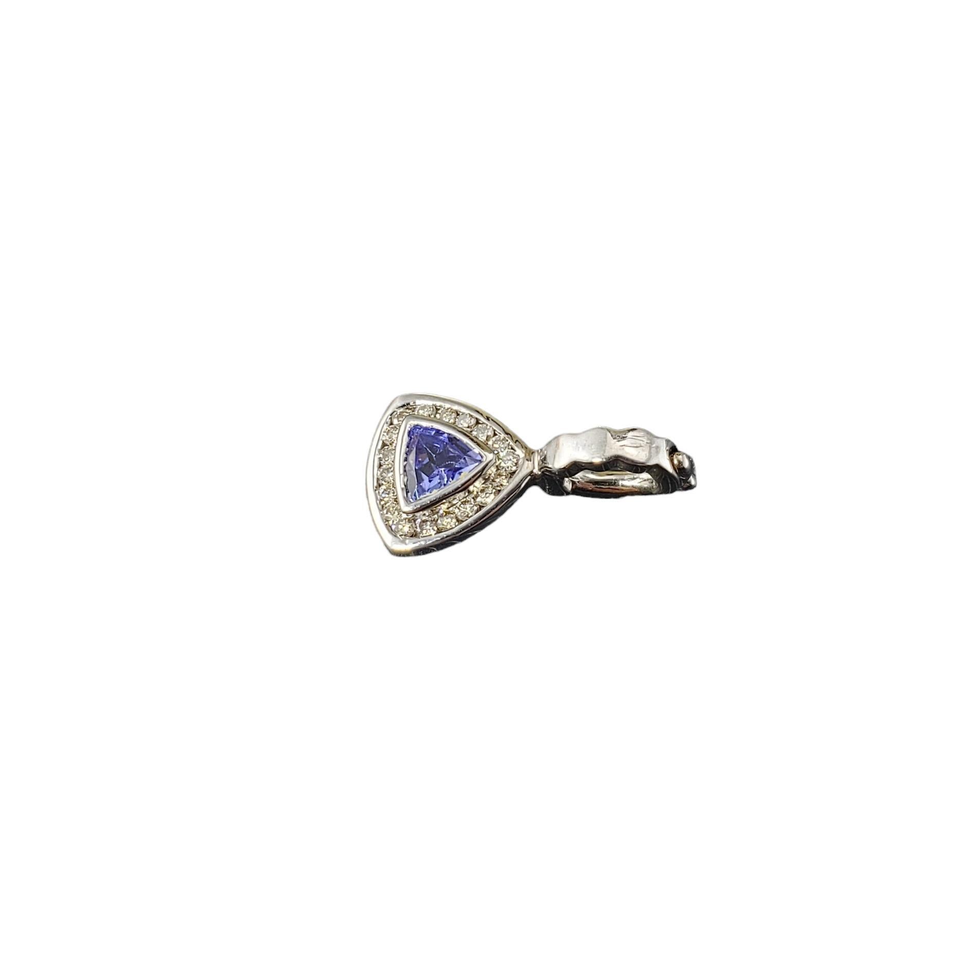 14K White Gold Tanzanite and Diamond Pendant-

This lovely pendant features one natural tanzanite stone surrounded by 18 round brilliant cut diamonds set in classic 14K white gold.

Approximate total diamond weight: .36ct.

Diamond color: