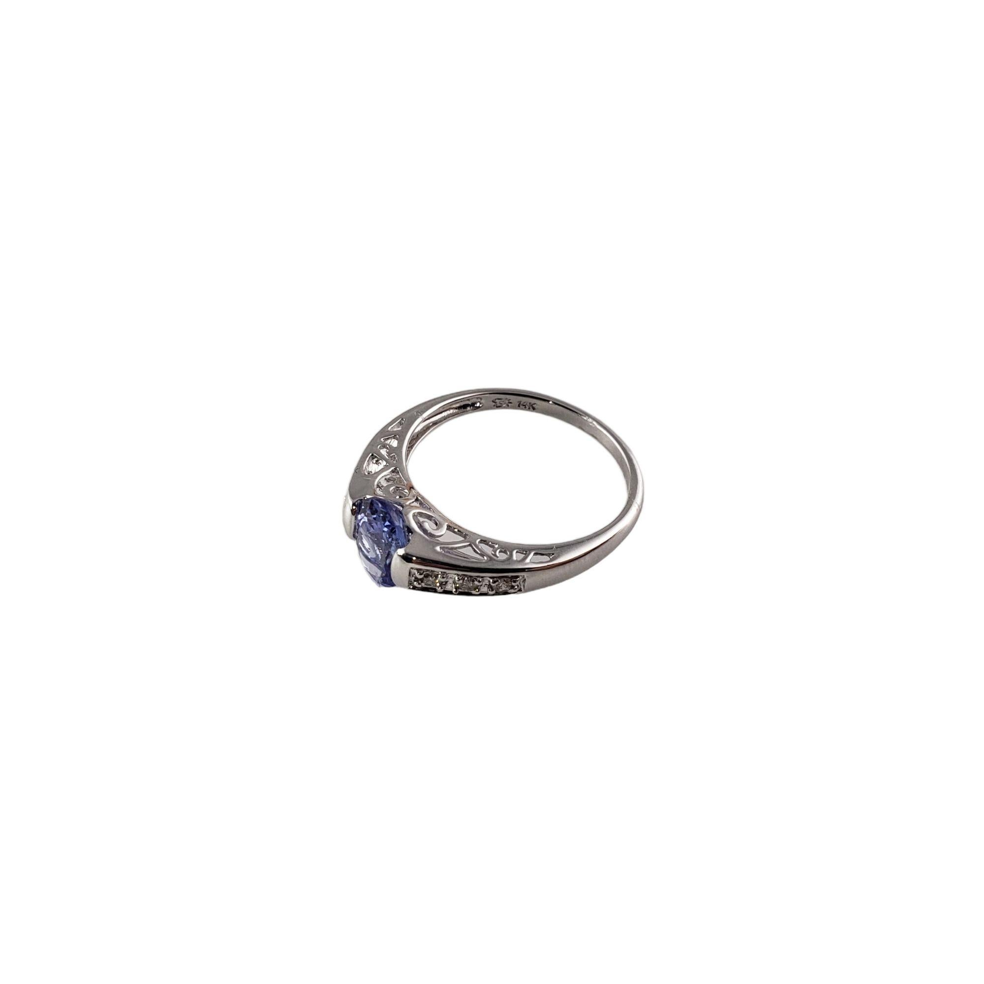 Vintage 14 Karat White Gold Tanzanite and Diamond Ring Size 7 JAGi Certified -

This lovely ring features one oval tanzanite (8 mm x 5 mm) and six round brilliant cut diamonds set in beautifully detailed 14K white gold.
Shank: 2 mm.

Total diamond