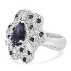 14 Karat White Gold Tanzanite, Sapphire & Diamond Flower Ring