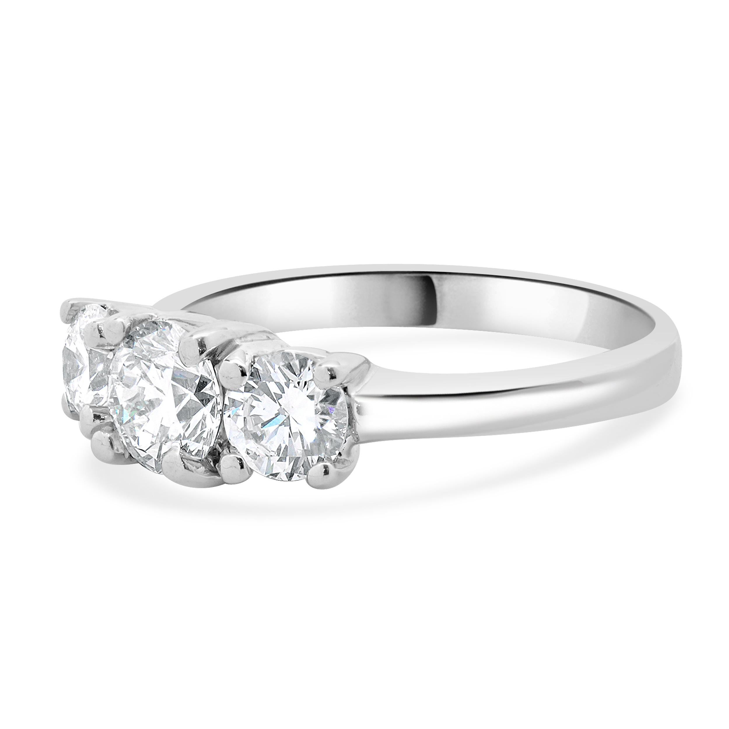 Designer: custom
Material: 14K white gold
Diamond: 1 round brilliant cut = 0.70ct
Color: I
Clarity: VS1
Diamond: 2 round brilliant cut = 0.75cttw
Color: H
Clarity: VS1-2
Dimensions: ring top measures 6mm wide
Ring Size: 8 (complimentary sizing