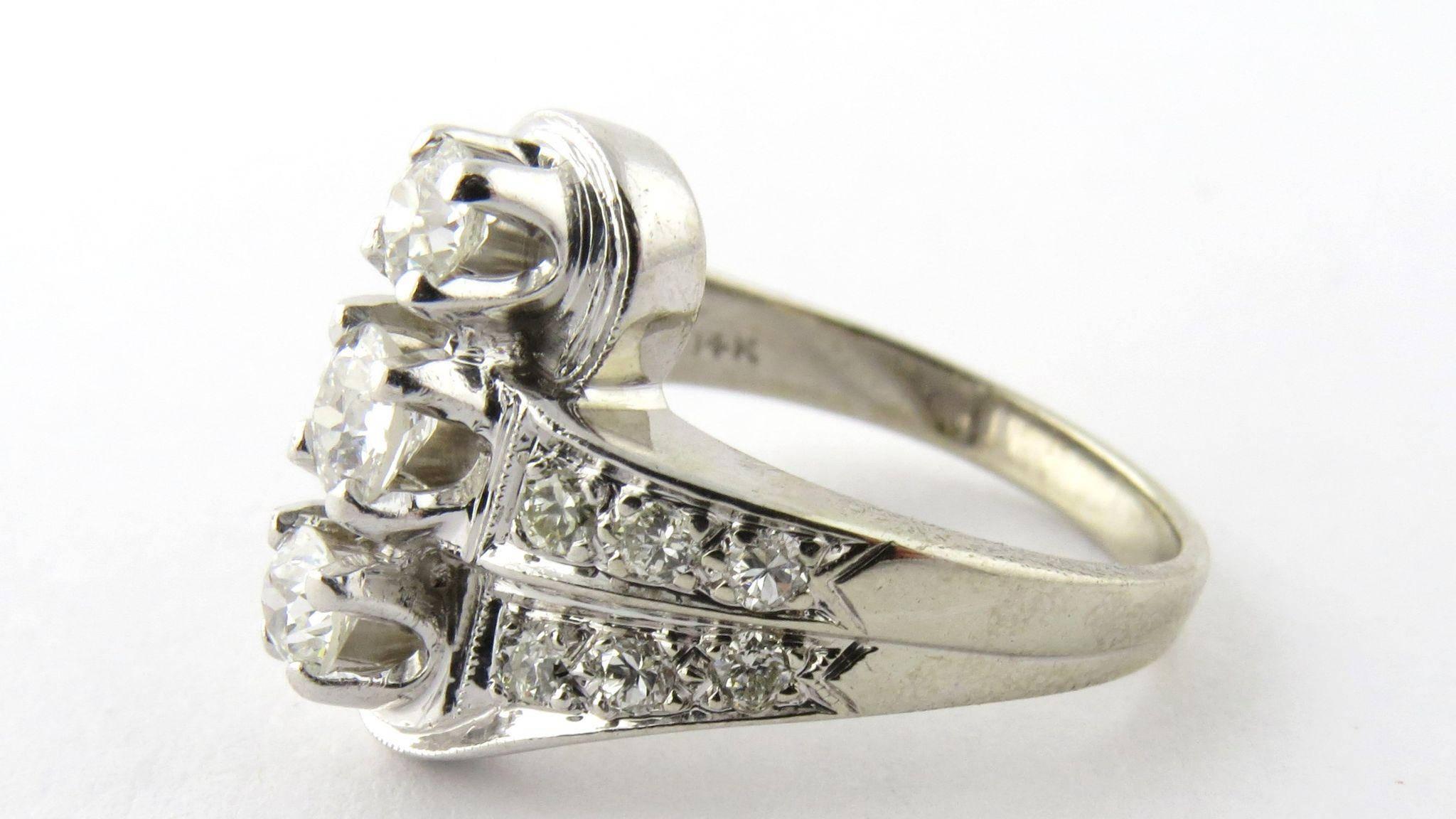 Vintage 14K White Gold 3 Stone Center Row Diamond Ring. 

3 pronged set lovely diamonds set in a top row with 2 side diamond bands on each side totaling 12 diamonds. 

Approximate total diamond weight 1.33ct. 

Size 7 1/4 6.5g, 4.15dwt Measures: