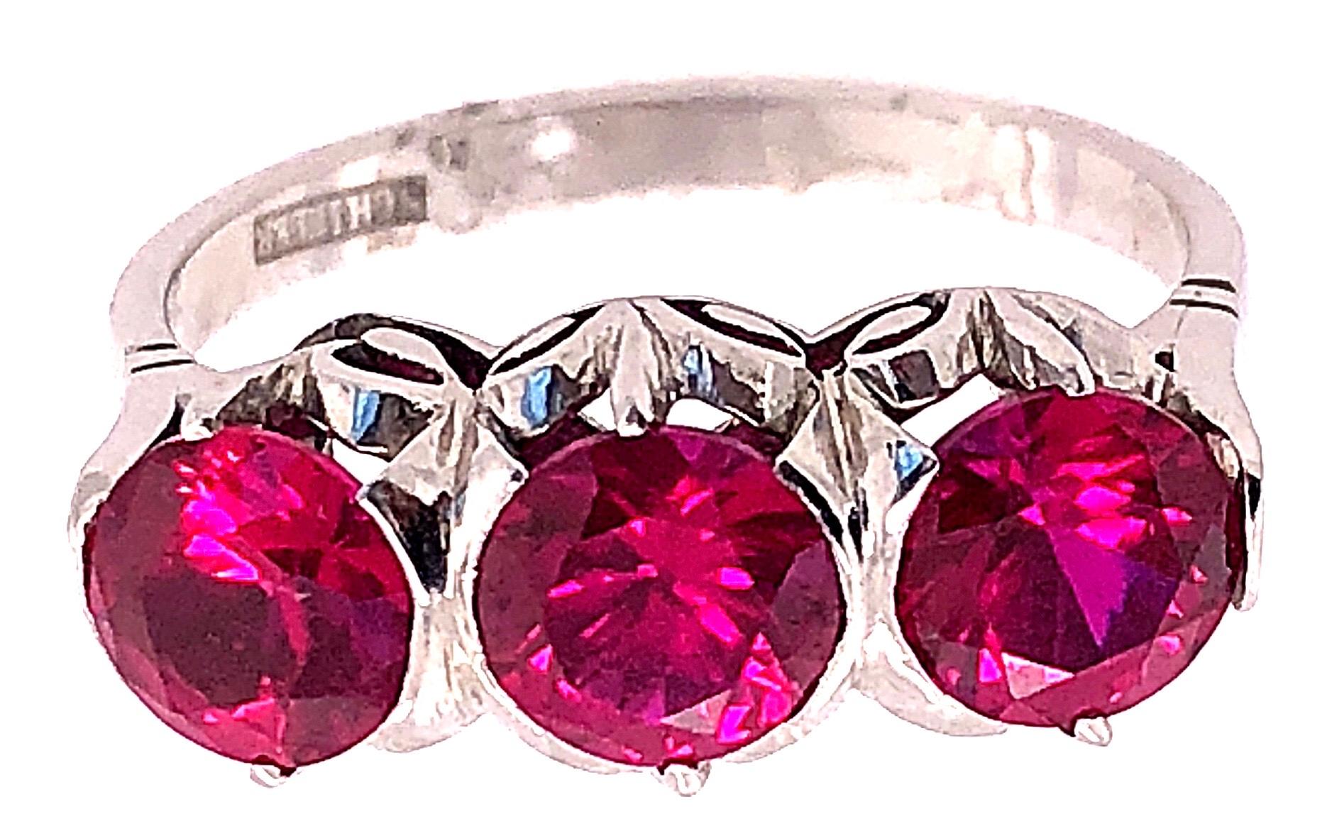 14 Karat White Gold Contemporary Ruby Ring Schiller Stamped.
Size 9.
3 piece ruby 6.00 mm x 6.00 mm.
6 grams total weight.
7.98 ring height.