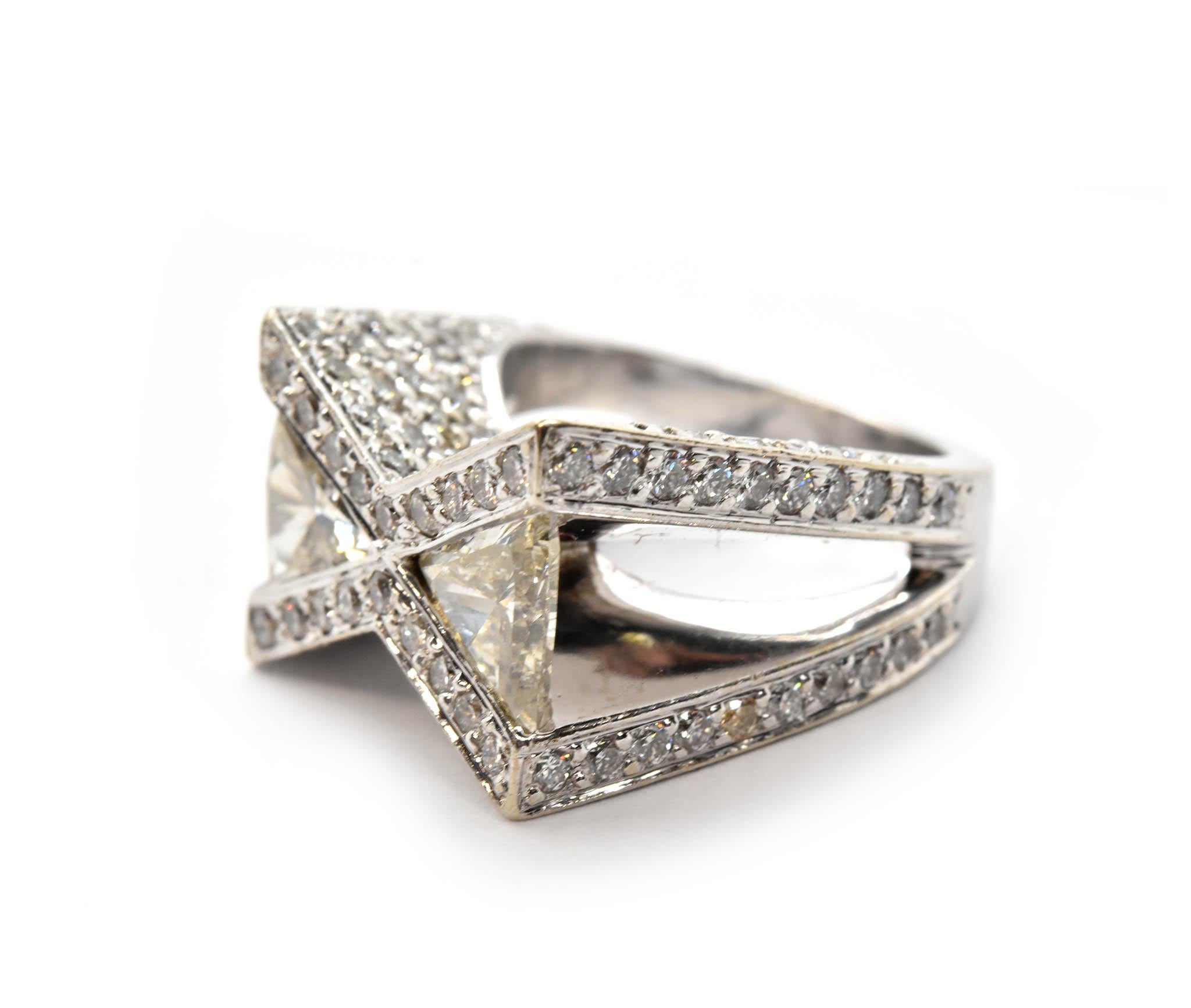 Showcased with the open style mounting are the dual trilliant cut 1.00cttw diamonds set into this ring! The trilliant diamonds are mesmerizing when viewed from any angle, however seeing the underside of them showcases their fire perfectly! Set on