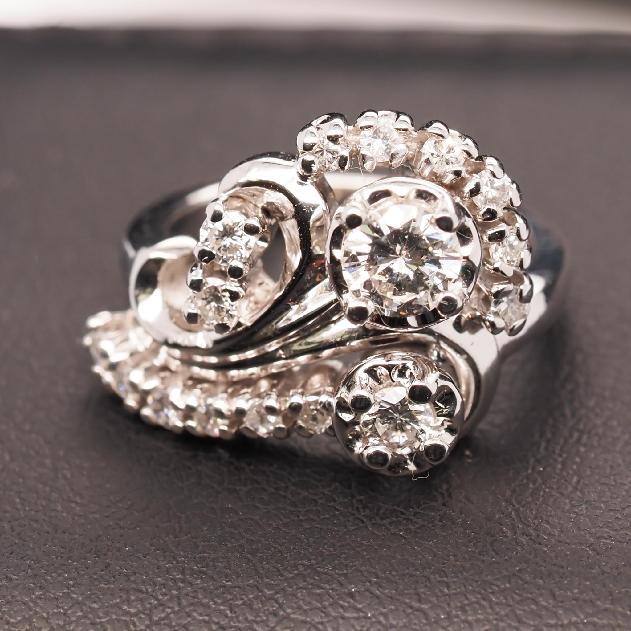 Year: 1960s

Item Details:
Ring Size: 3.5
Metal Type: 14K White Gold [Hallmarked, and Tested]
Weight: 6.2 grams

Diamond Details: .60ct total weight, H Color, SI2-I1 clarity, Round Brilliant, Natural Diamonds

Band Width: 2 mm
Condition: Excellent

