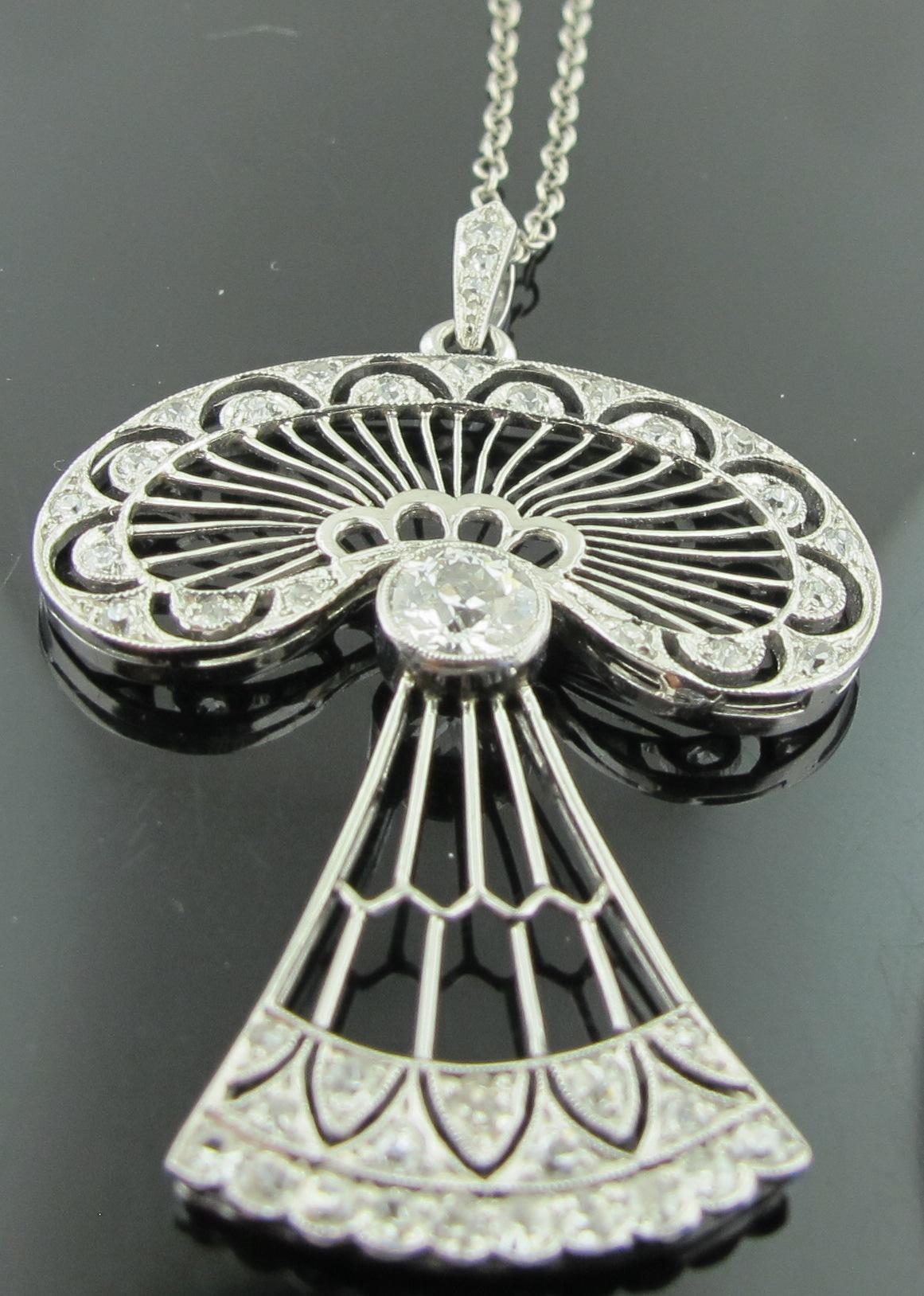 Early 1900's Vintage 14 karat white gold Art Nouveau diamond necklace.  Center diamond is an Old European Cut diamond weighing approximately 0.50 carats with 42 additional diamonds weighing 0.20 carats, with a total diamond weight of 0.80 carats.  