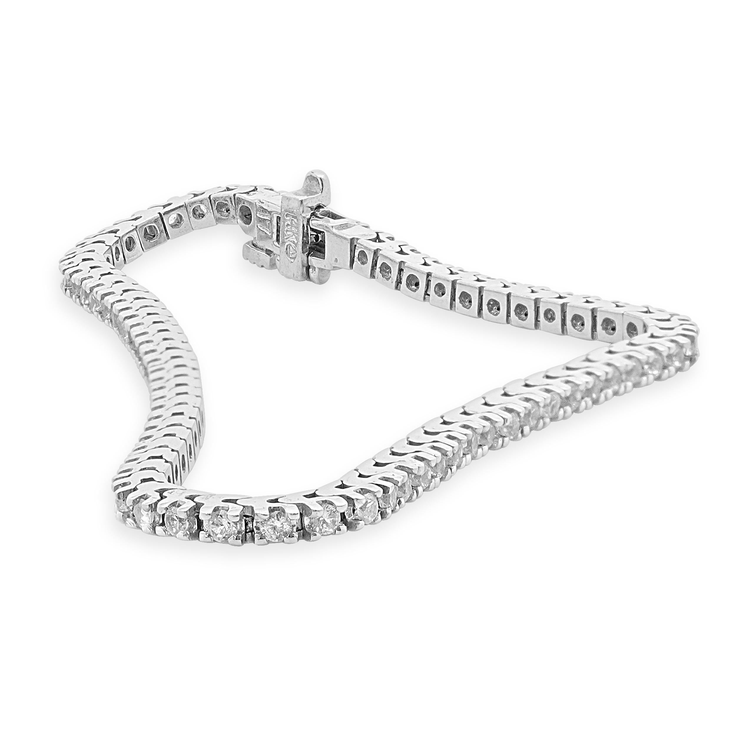 Designer: custom
Material: 14K white gold
Sapphire: 77 round cut = 1.89cttw
Weight: 8.96 grams
Dimensions: bracelet will fit up to a 6.5-inch wrist