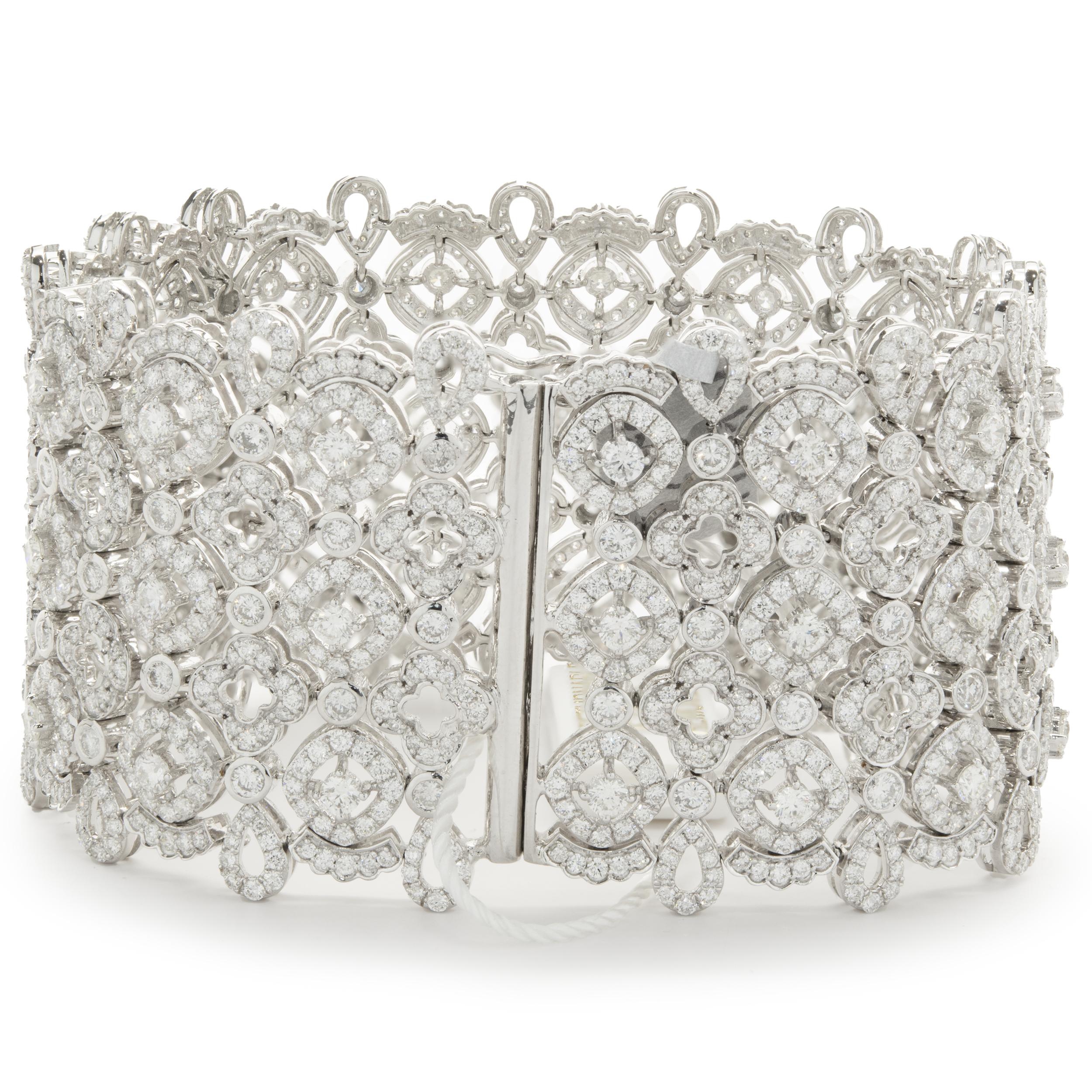 Designer: custom design
Material: 14K white gold
Diamonds: round brilliant cut = 20.45cttw
Color: F / G
Clarity: VS1-2
Dimensions: bracelet measures 7.25-inches in length 
Weight: 79.78 grams
