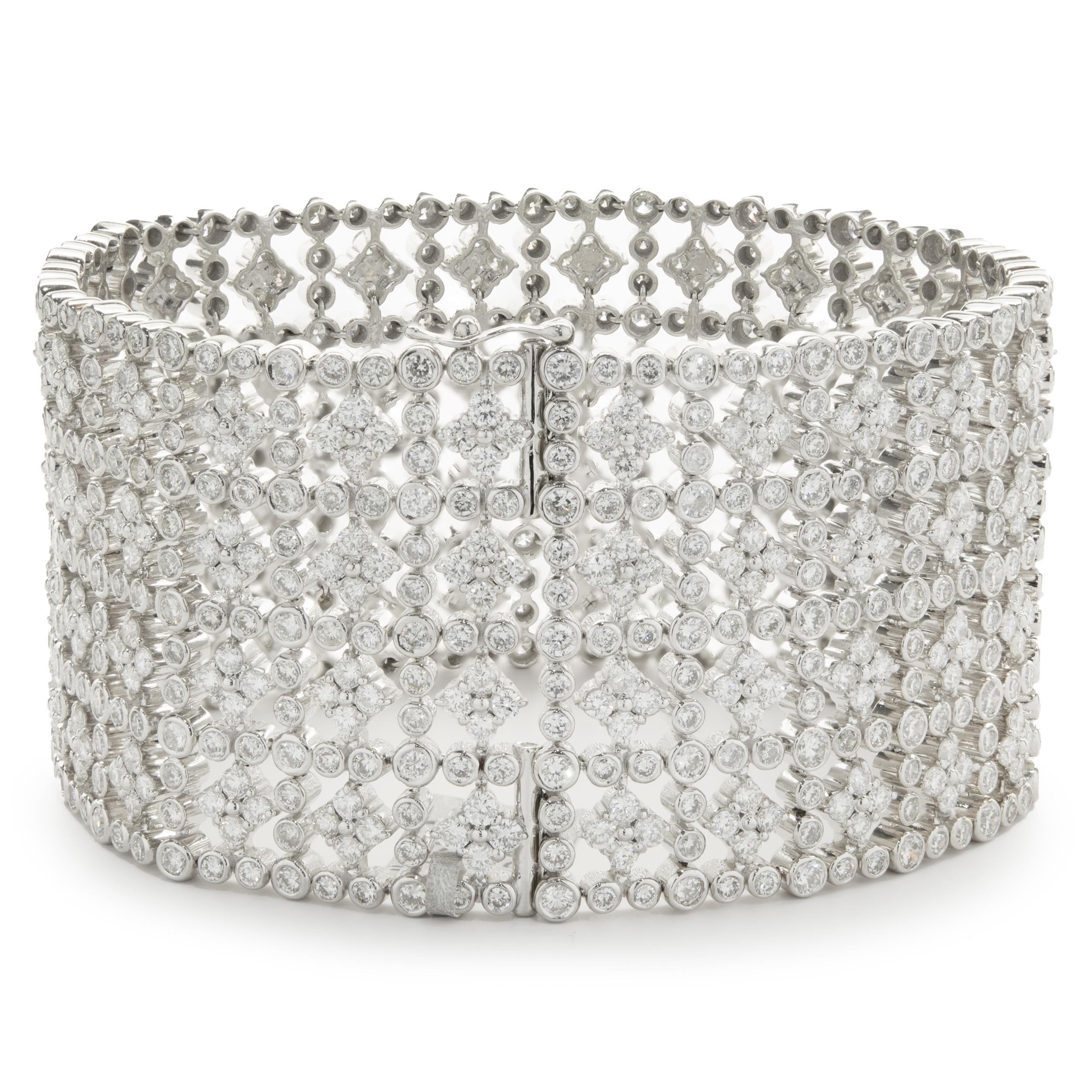 Designer: custom design
Material: 14K white gold
Diamonds: 866 round brilliant cut = 28.91cttw
Color: F / G
Clarity: VS1-2
Dimensions: bracelet measures 7.25-inches in length 
Weight: 89.55 grams
