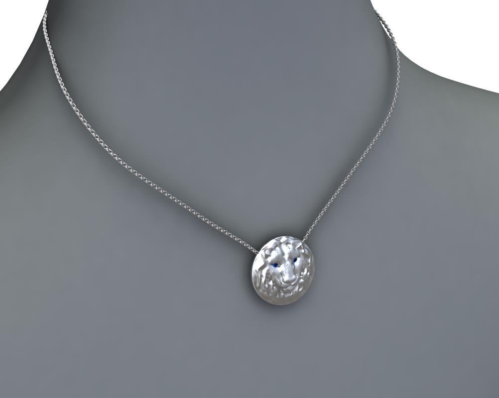 Tiffany designer , Thomas Kurilla created this 14k White Gold Lion Pendant,  Matte finish, 21 mm diameter x 5.4 high on a 18 inch chain 1.5 mm wide. 1.4 mm sapphire eyes . This chain is for women. It is too fine for men.

 I would recommend a 1.9