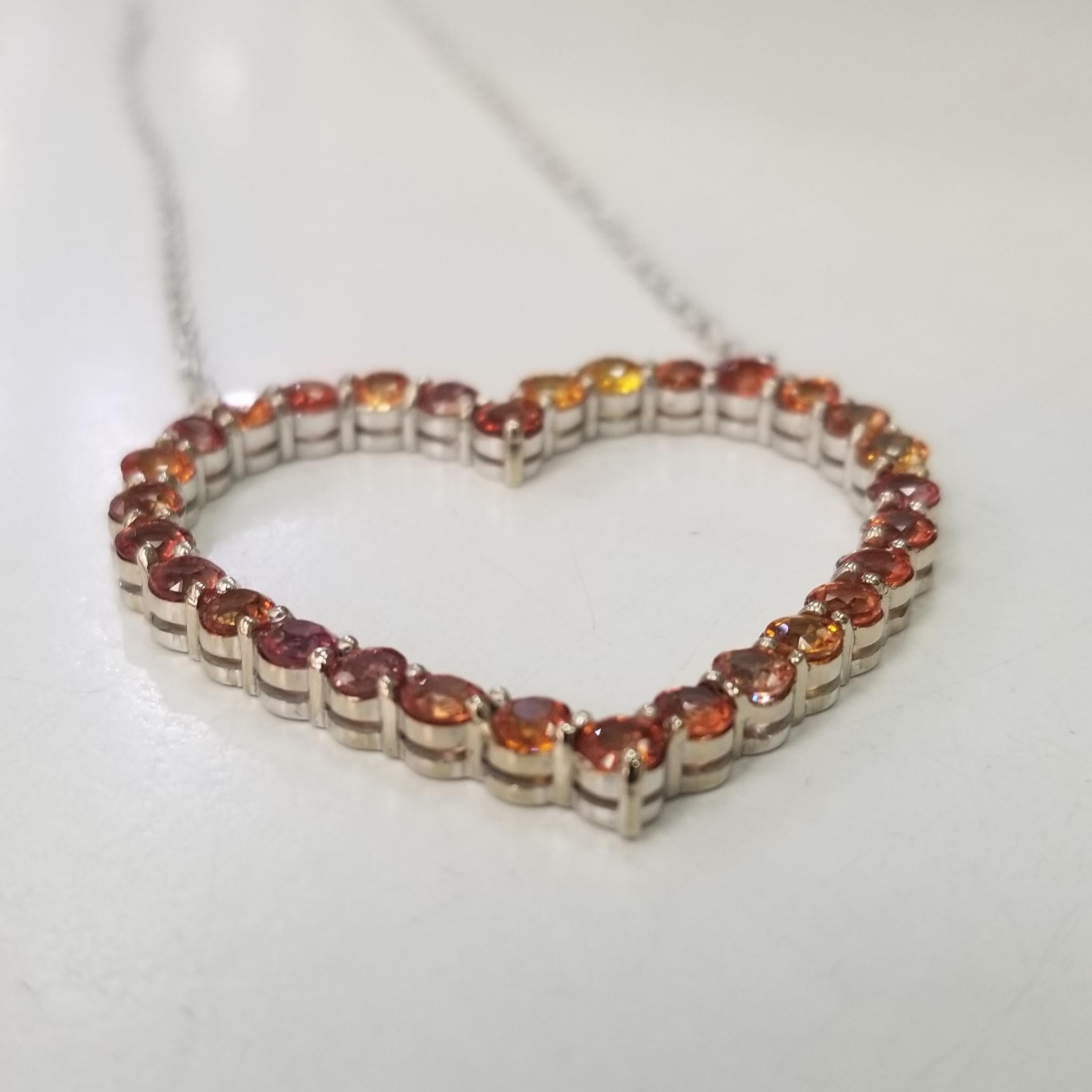 Specifications:
    PENDANT LENGTH: 1 1/2 inches
    PENDANT WIDTH: 1 1/2 inches
    CHAIN length:18 inch
    CHAIN & PENDANT weight: 12.12 gram
    STONES:  30  Sapphires yellow or orange
    TOTAL CARAT WEIGHT:   8.01cts.
    metal:14k WHITE GOLD
