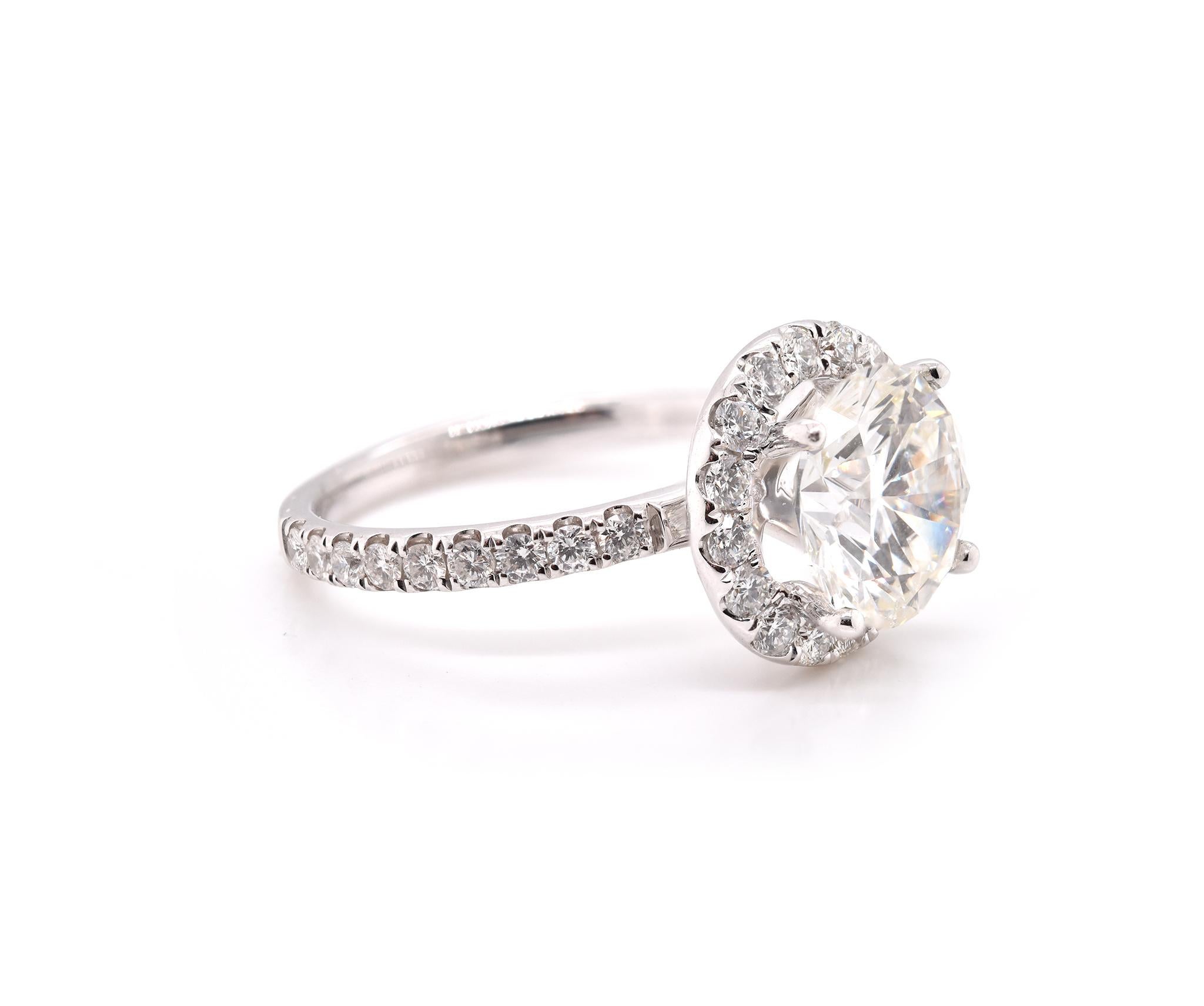 Designer: custom design
Material: 14k white gold
Center Diamond: 1 round brilliant cut = 3.03ct
Color: K
Clarity: I1
Diamonds: 33D= .66cttw
Color: G-H
Clarity: VS2-SI1
Ring Size: 7 (please allow two additional shipping days for sizing