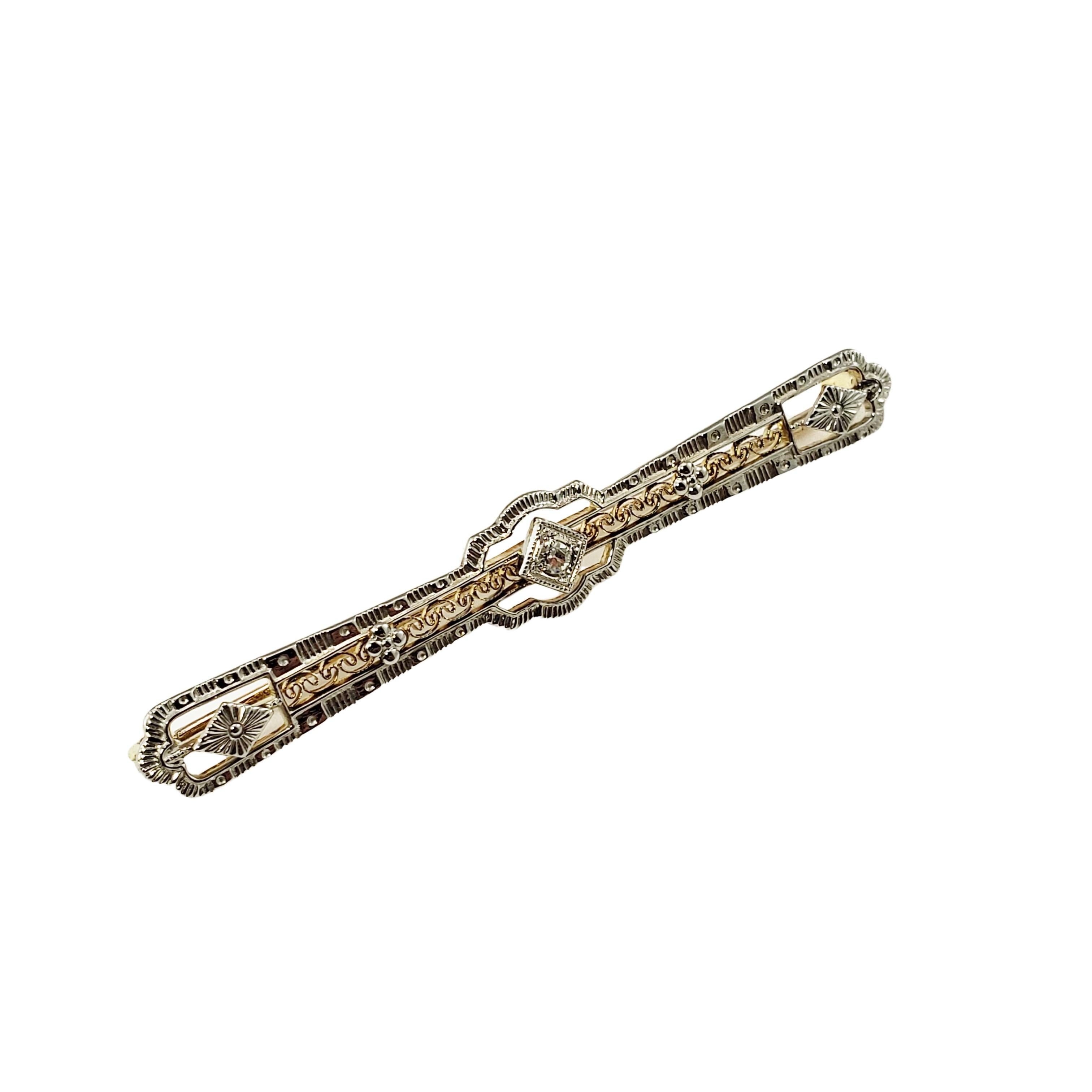 14 Karat White/Yellow Gold and Diamond Bar Brooch/Pin-

This elegant brooch features one round single cut diamond set in beautifully detailed 14K white and yellow gold.  

Approximate total diamond weight: .03 ct.

Diamond color: K

Diamond clarity: