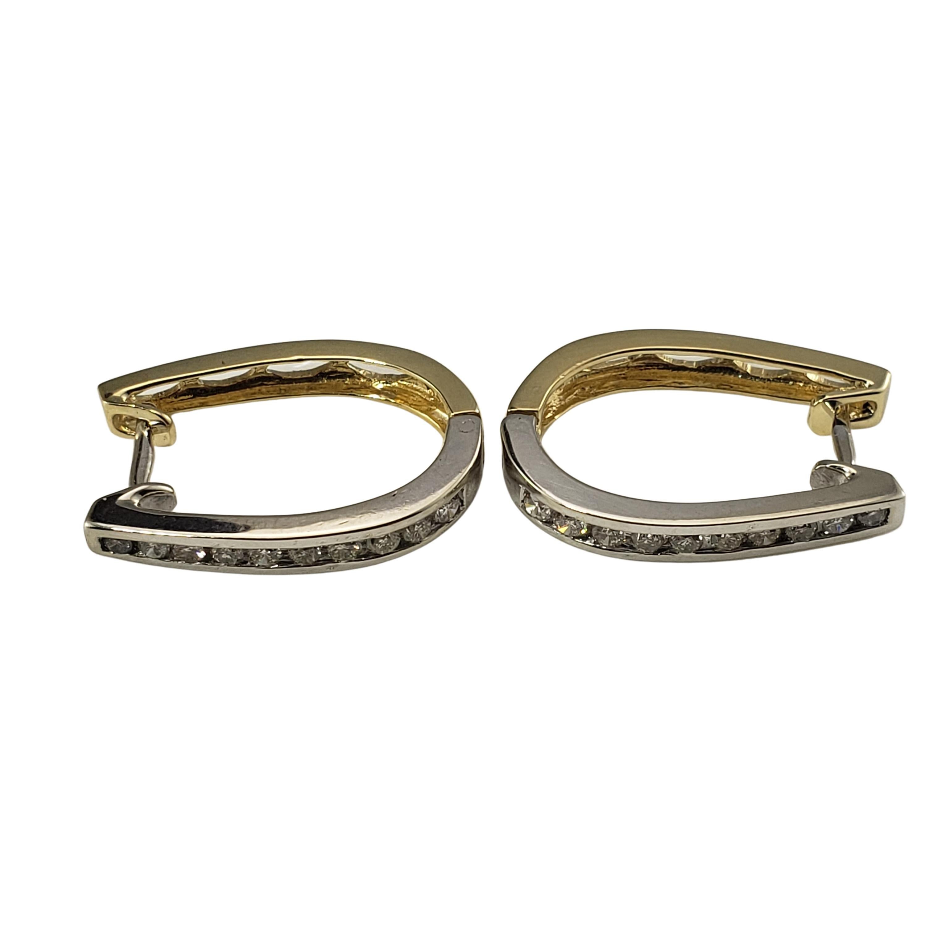 14 Karat White/Yellow Gold and Diamond Hoop Earrings-

These hinged hoop earrings feature ten round brilliant cut diamonds set in classic 14K white and yellow gold.
Front of earrings are white gold, backs are yellow gold.  Width:  3 mm.

Approximate