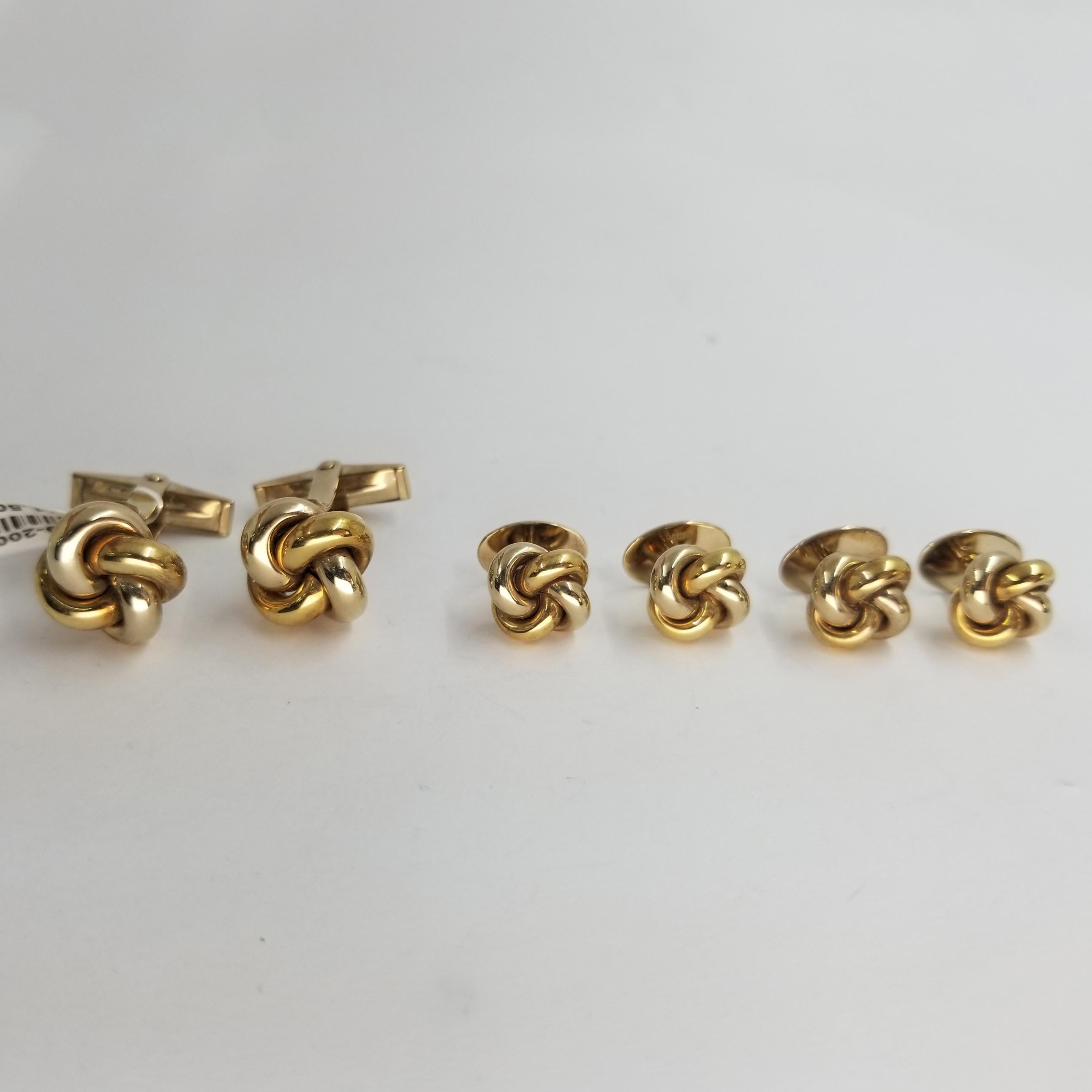 Set of 4 Tuxedo Shirt Studs and 2 cufflinks crafted in 14 karat white & yellow gold (stamped) with a knot design. The cufflinks have hinged backs for easy dressing and removal.