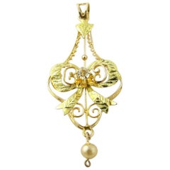 14 Karat Yellow and Green Gold White Spinel Filigree Bow Pendant