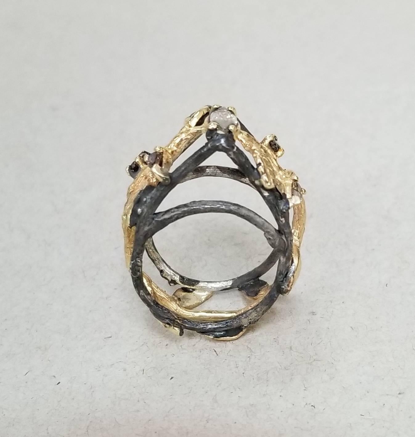 14k yellow gold and silver Gresha signature bark and leaf ring with 1 natural brown marquise cut diamond weighing .32 and 4 natural brown pear shape cut diamonds weighing .49pts. set in a 14k yellow gold bark and leaf inlaid in silver that has been