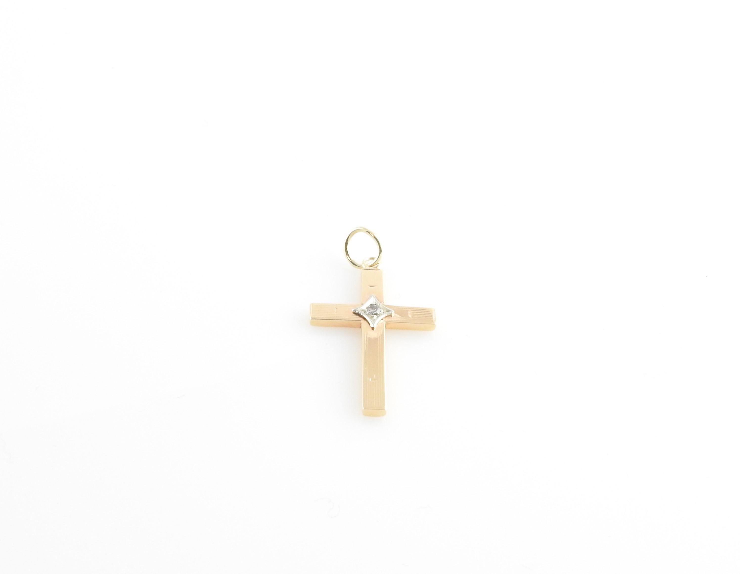 Vintage 14 Karat Yellow Gold and Diamond Cross Pendant

This lovely 14K Yellow gold cross pendant features one round single cut diamond set in beautifully detailed 14K white gold.

Approximate total diamond weight: .02 ct.

Diamond color: I

Diamond
