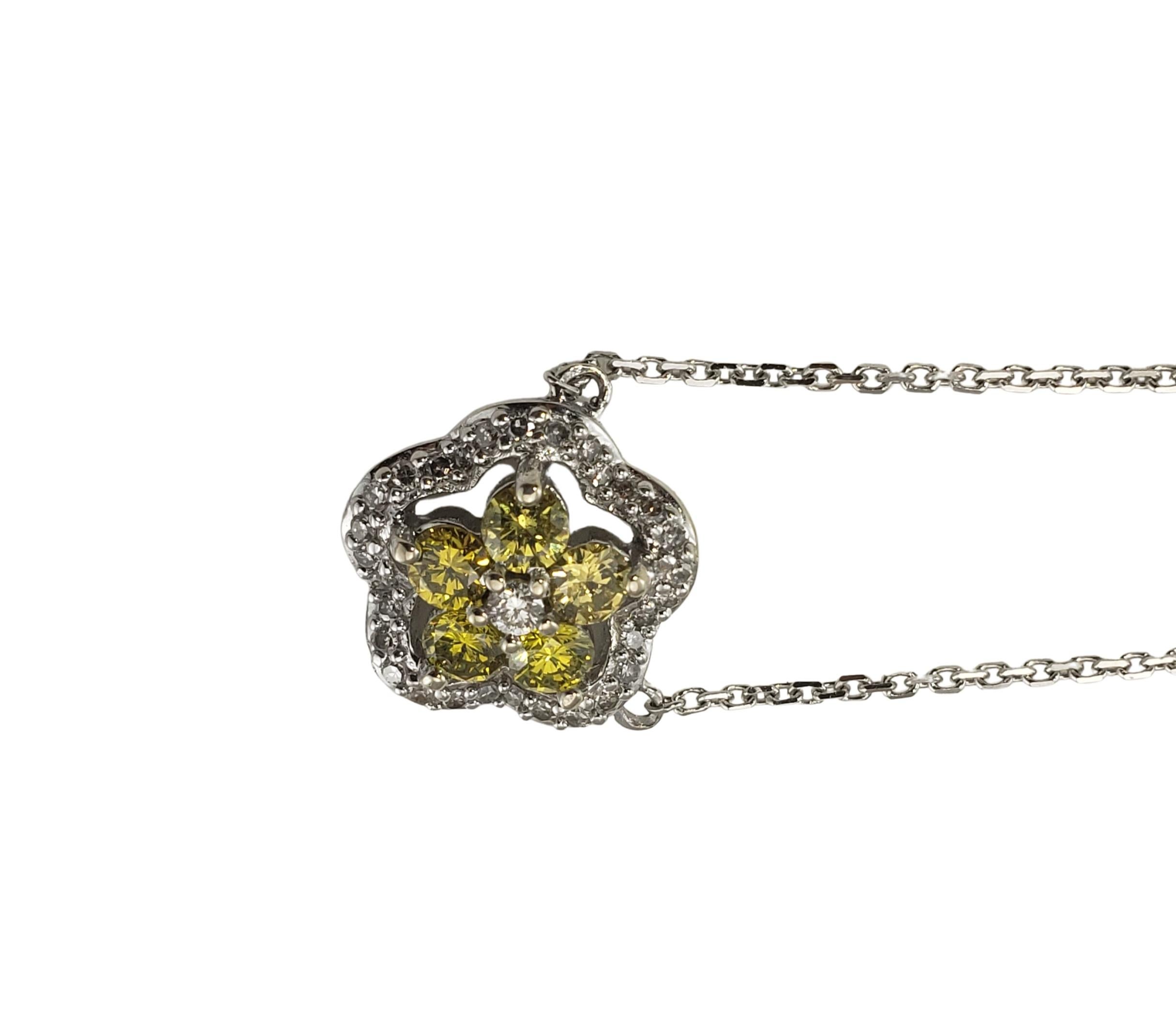 14 Karat White/Yellow Gold and Diamond Pendant Necklace GAI Certified-

This sparkling pendant features five round yellow single cut diamonds and 30 round white brilliant cut diamonds set in classic 14K white gold.  Suspends from a classic cable