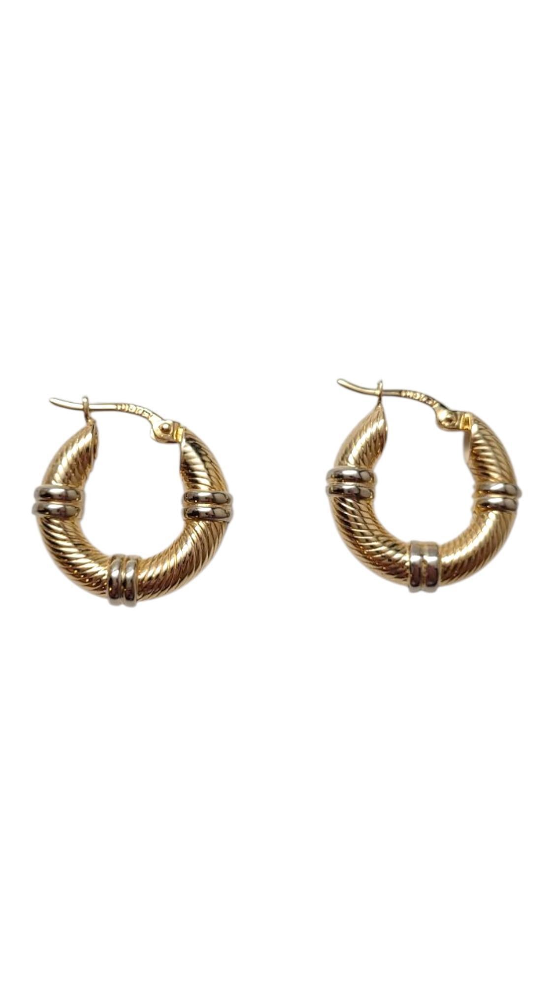 14 Karat Yellow and White Gold Cable Hoop Earrings

This piece is the perfect accessory to an elegant outfit! These hoop earrings feature a 14 karat yellow gold base decorated with white gold accents.

Size: 19.6 mm X 19.7 mm X 5.2 mm

Weight: 4.9 g