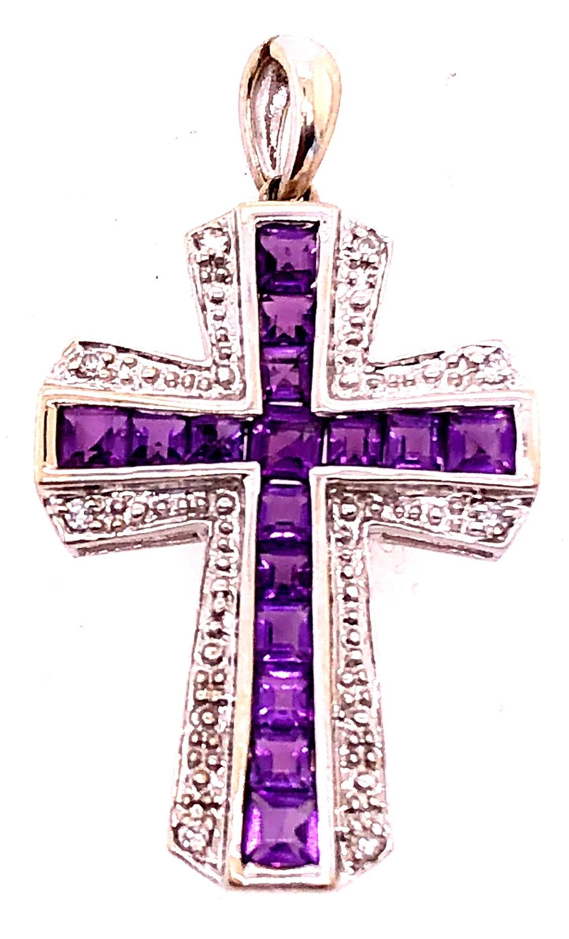 14 Karat Yellow and White Gold Charm Pendant with Diamond and Amethyst.
8 piece round diamond and 16 piece square cushion amethyst.
3 grams total weight
30.78 height