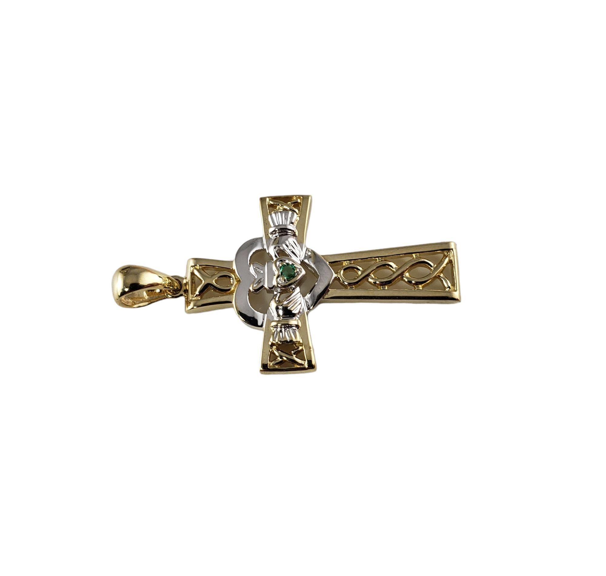 Vintage 14 Karat Yellow and White Gold Claddagh Cross Pendant-

This lovely claddagh cross pendant features one green faceted stone set in beautifully detailed 14K yellow and white gold.

Size: 30 mm x 20 mm

Weight: 2.3 dwt. / 3.6 gr.

Stamped: