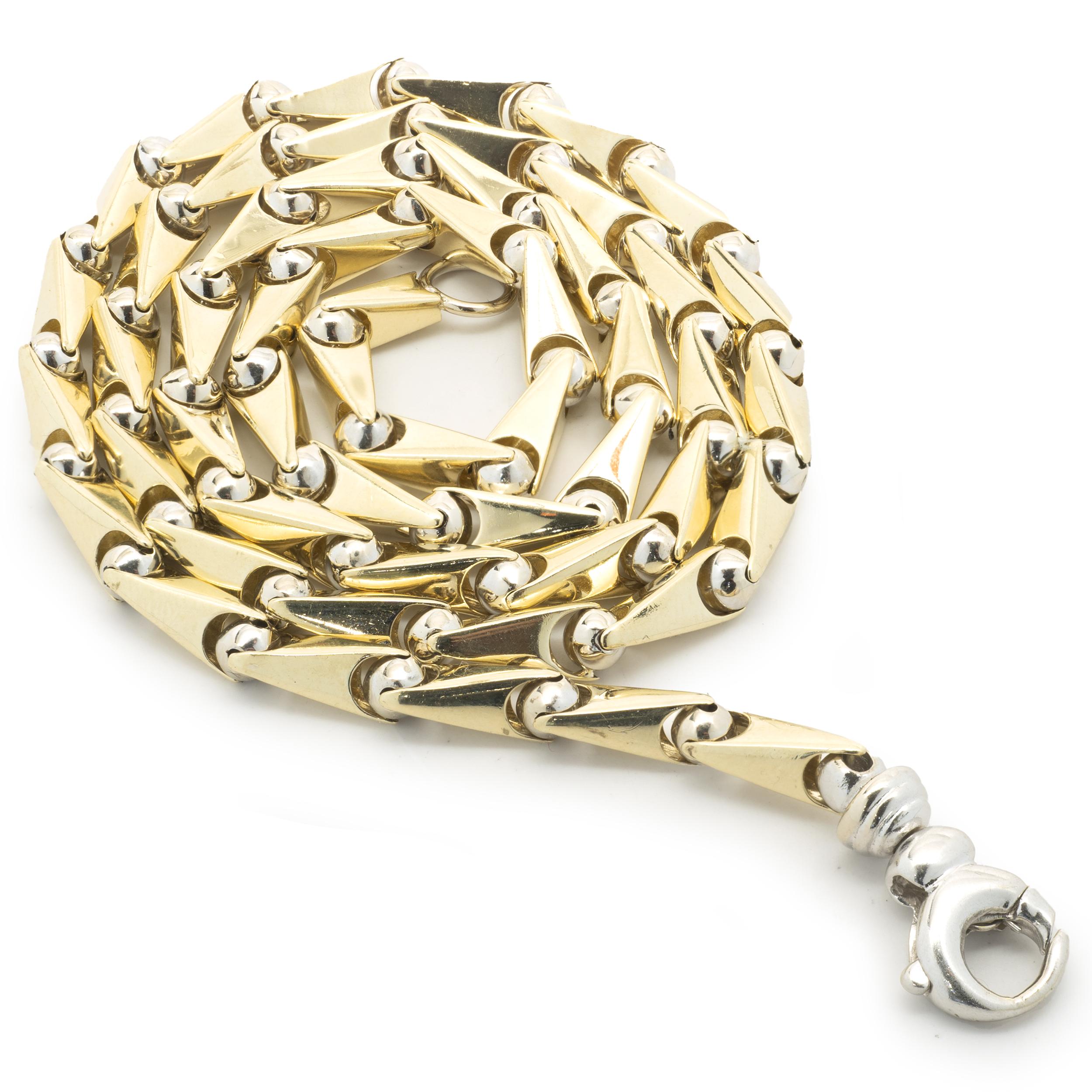 Matériau : or jaune et blanc 14K
Dimensions : le collier mesure 22 pouces de long et 4,85 mm de large
Poids : 31,64 grammes
