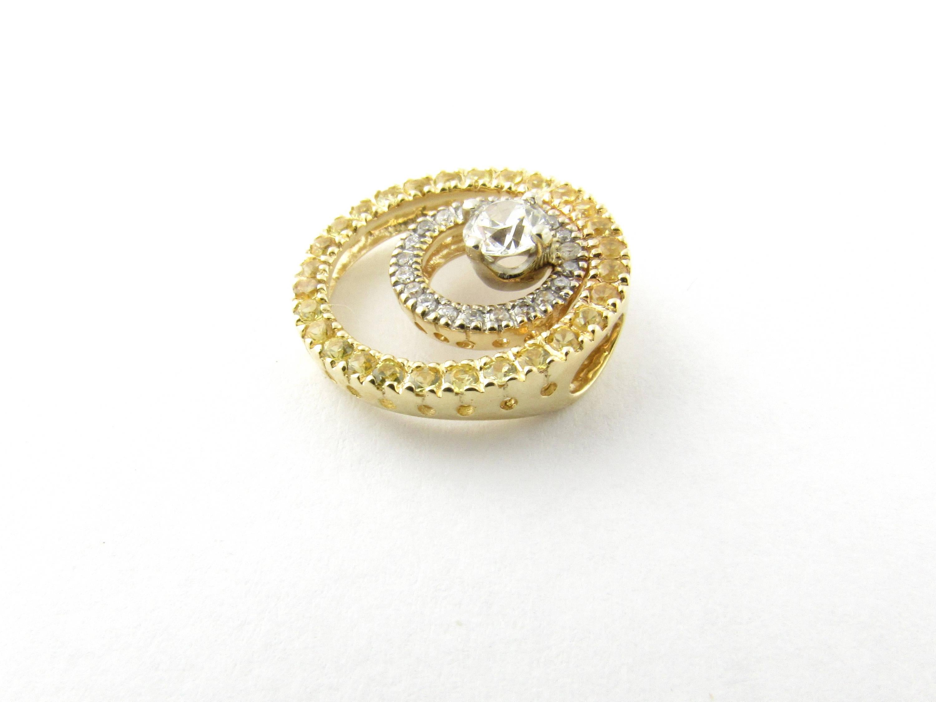 Vintage 14 Karat Yellow and White Gold Diamond Slide Pendant-

This sparkling slide pendant features one round brilliant cut diamond (.30 ct.) at its center surrounded by 21 round brilliant cut diamonds (.11 ct. twt.) set in 14K white gold in the