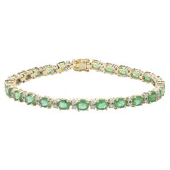 14 Karat Yellow and White Gold Emerald and Diamond Tennis Bracelet