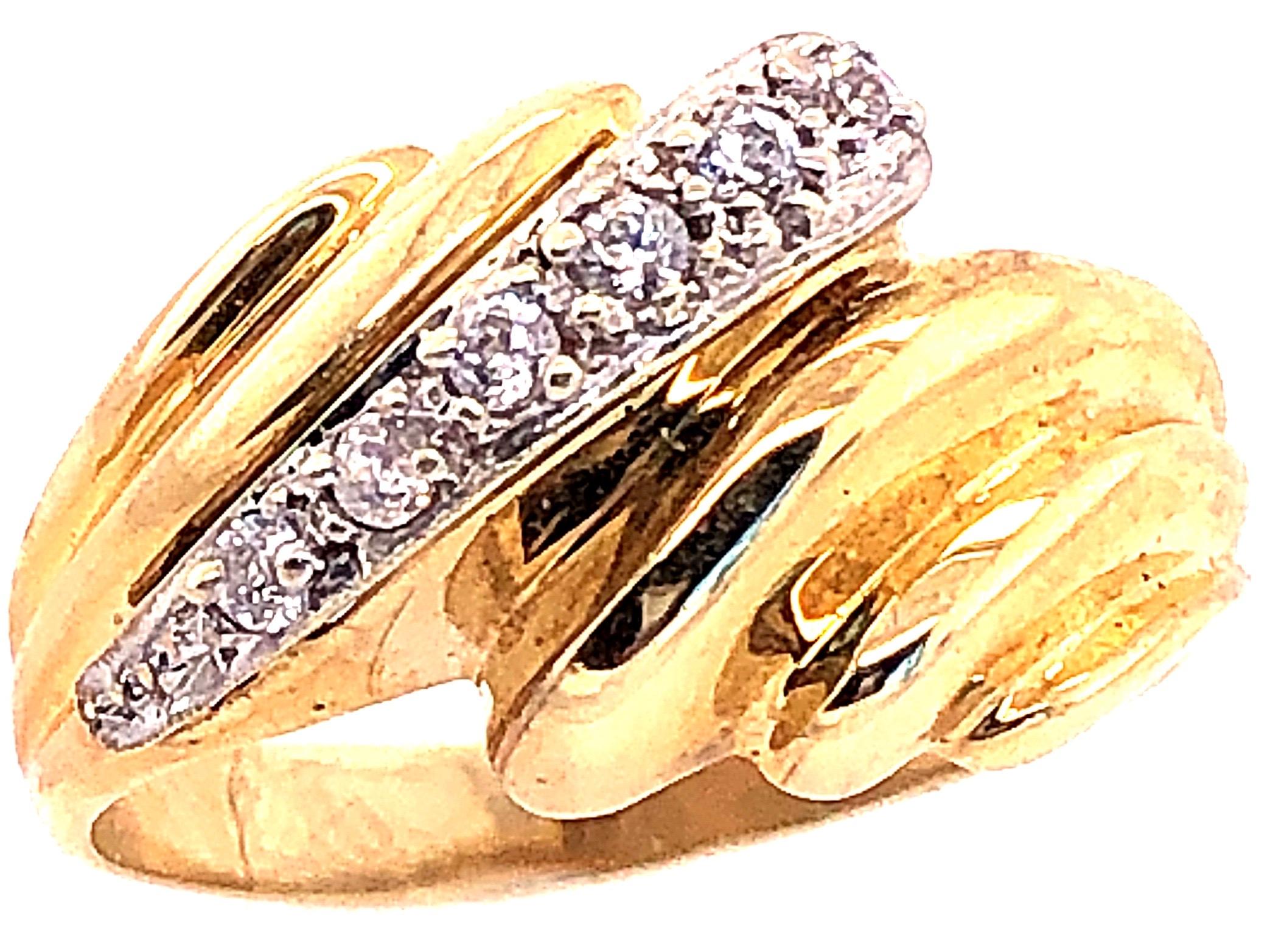 14 Karat Yellow and White Gold Fashion Ring with Round Diamonds Size 7.
0.25 total diamond weight.
4.06 grams total weight.