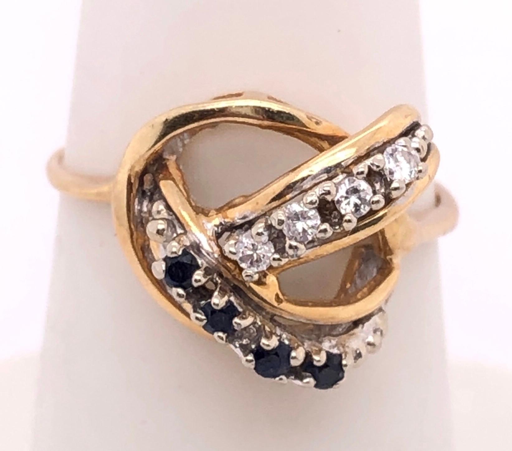 Contemporary 14 Karat Yellow and White Gold Freeform Ring with Sapphires and Diamonds For Sale