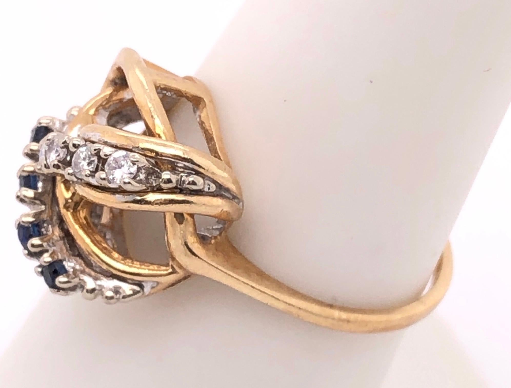 Contemporary 14 Karat Yellow and White Gold Freeform Ring with Sapphires and Diamonds For Sale