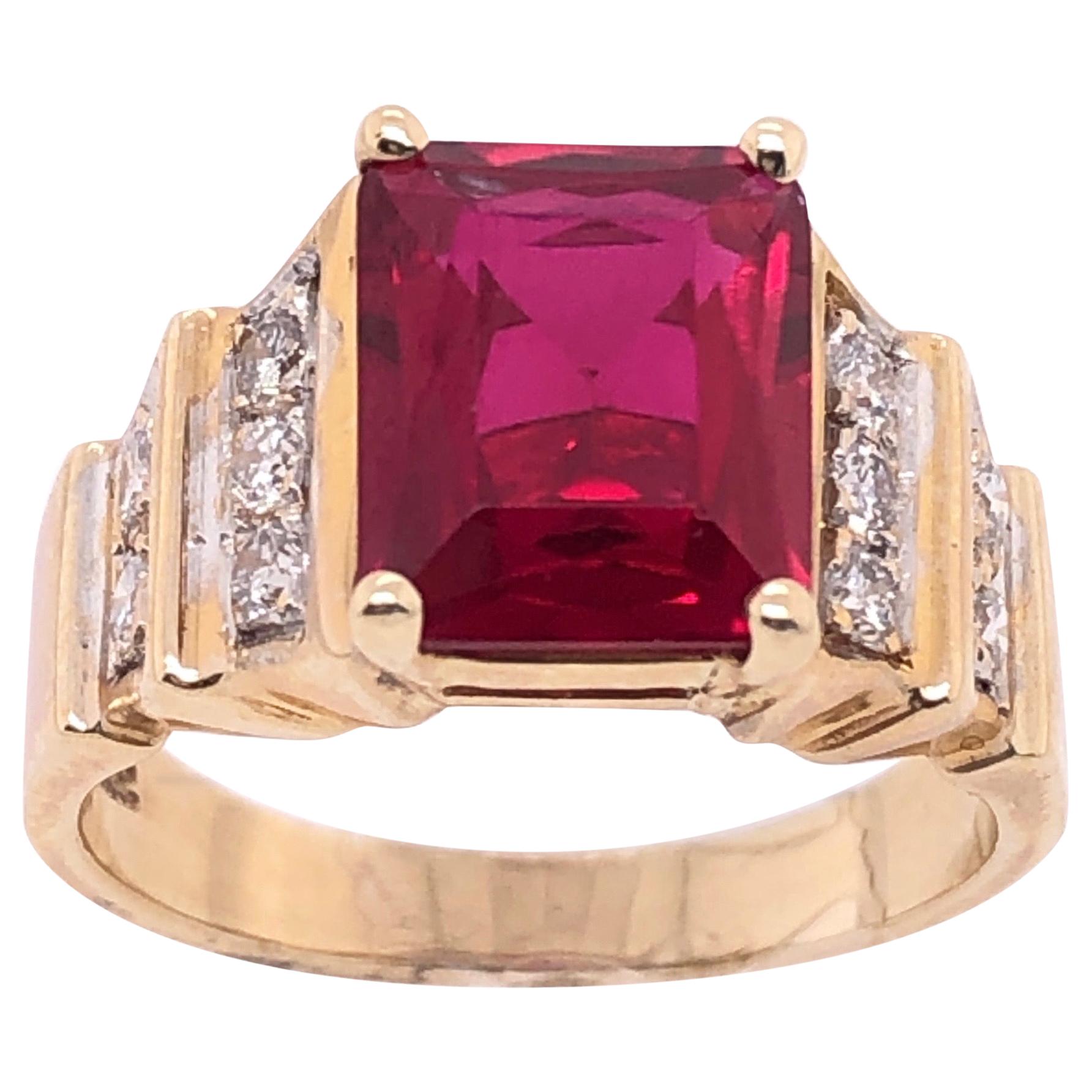 14 Karat Yellow and White Gold Free Form Ruby Ring with Round Diamonds