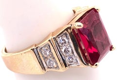 14 Karat Yellow and White Gold Free Form Ruby Ring with Round Diamonds
