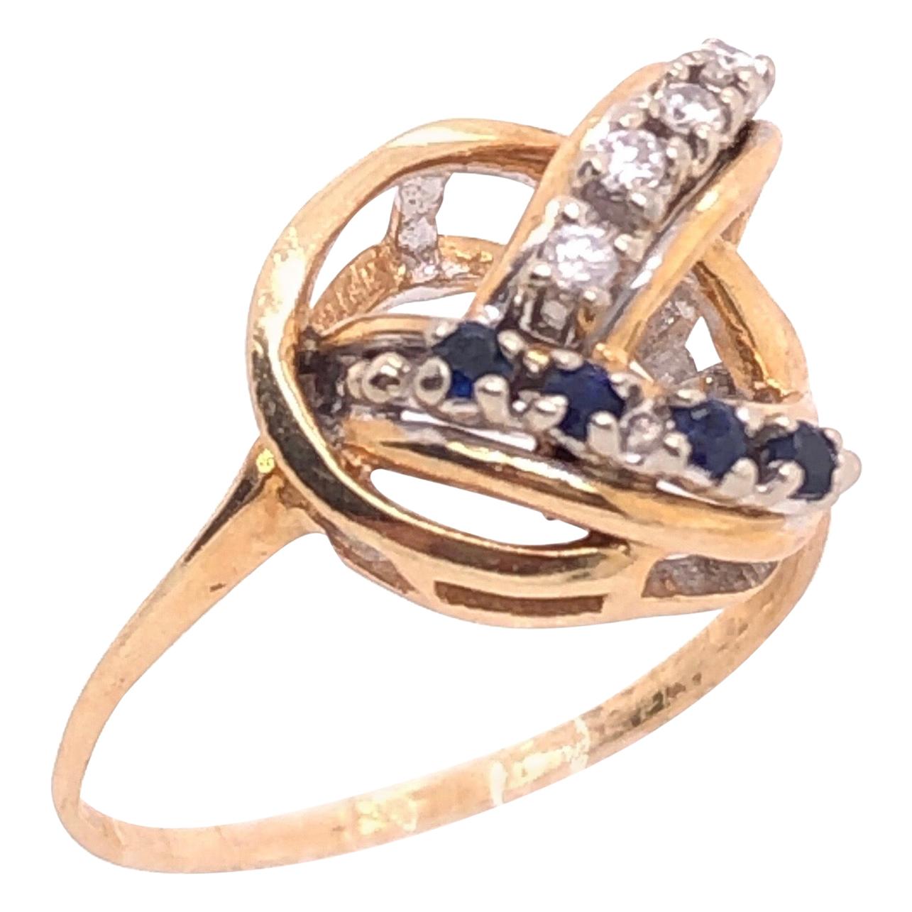 14 Karat Yellow and White Gold Freeform Ring with Sapphires and Diamonds