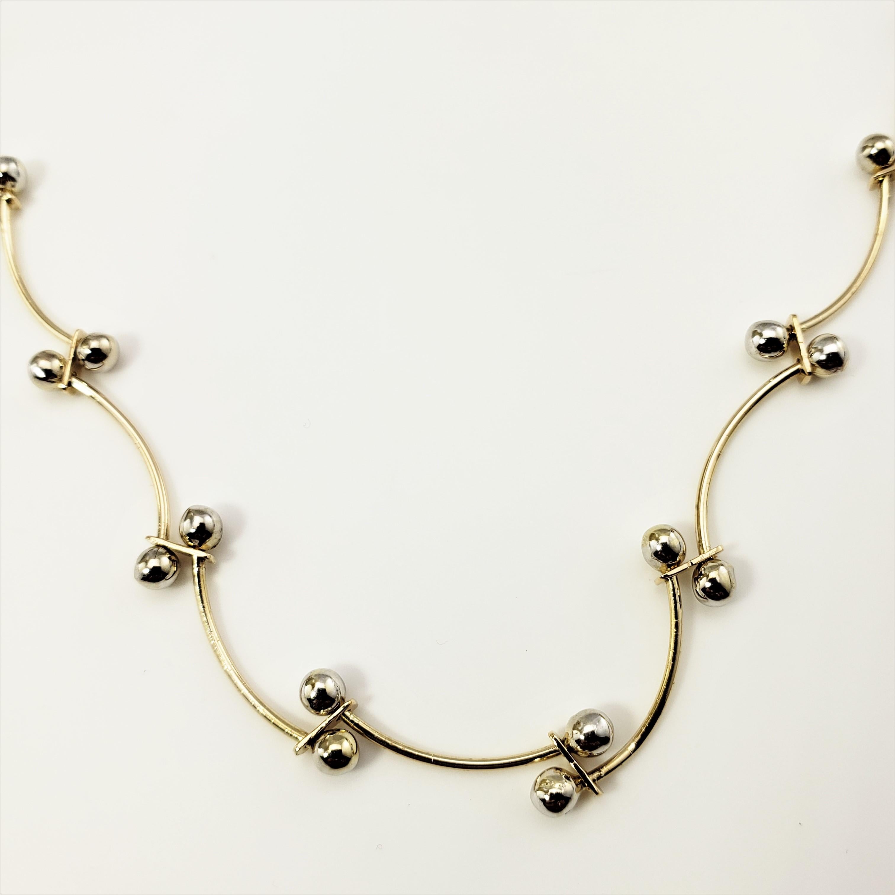14 Karat Yellow and White Gold Necklace-

This lovely necklace is crafted in beautifully detailed 14K yellow and white gold.

Size:  17.5 inches

Weight:  5.3 dwt. /  8.3 gr.

Stamped: 14K  MEXICO

Very good condition, professionally polished.

Will