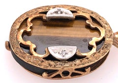 14 Karat Yellow and White Gold Pendant Tigers Eye Center Diamond Accent 0.02 TDW